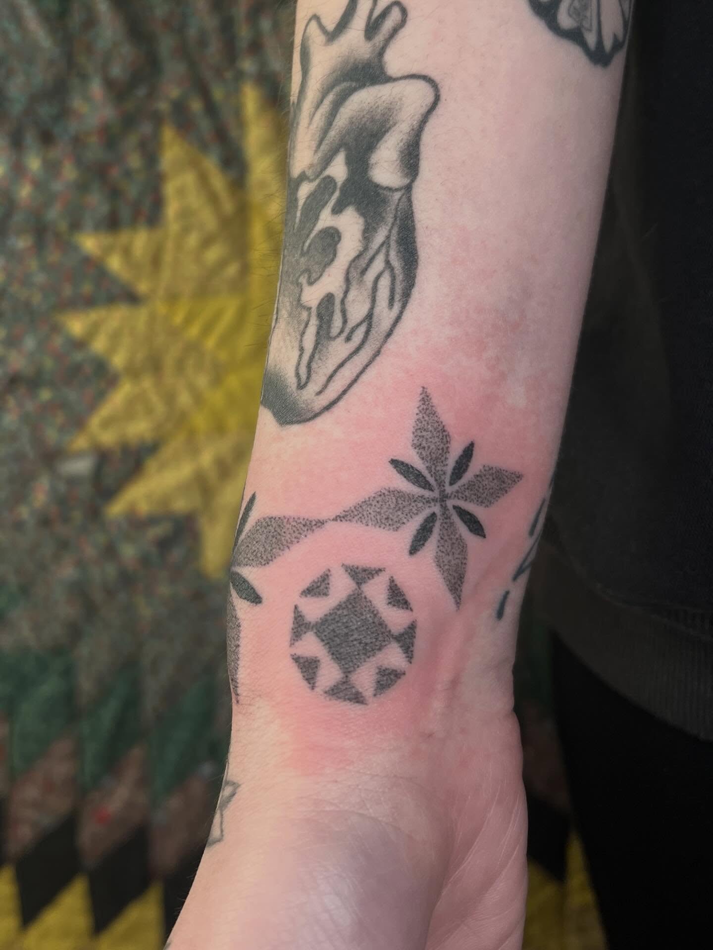 Geometric pattern dotwork tattoo on the forearm by faith