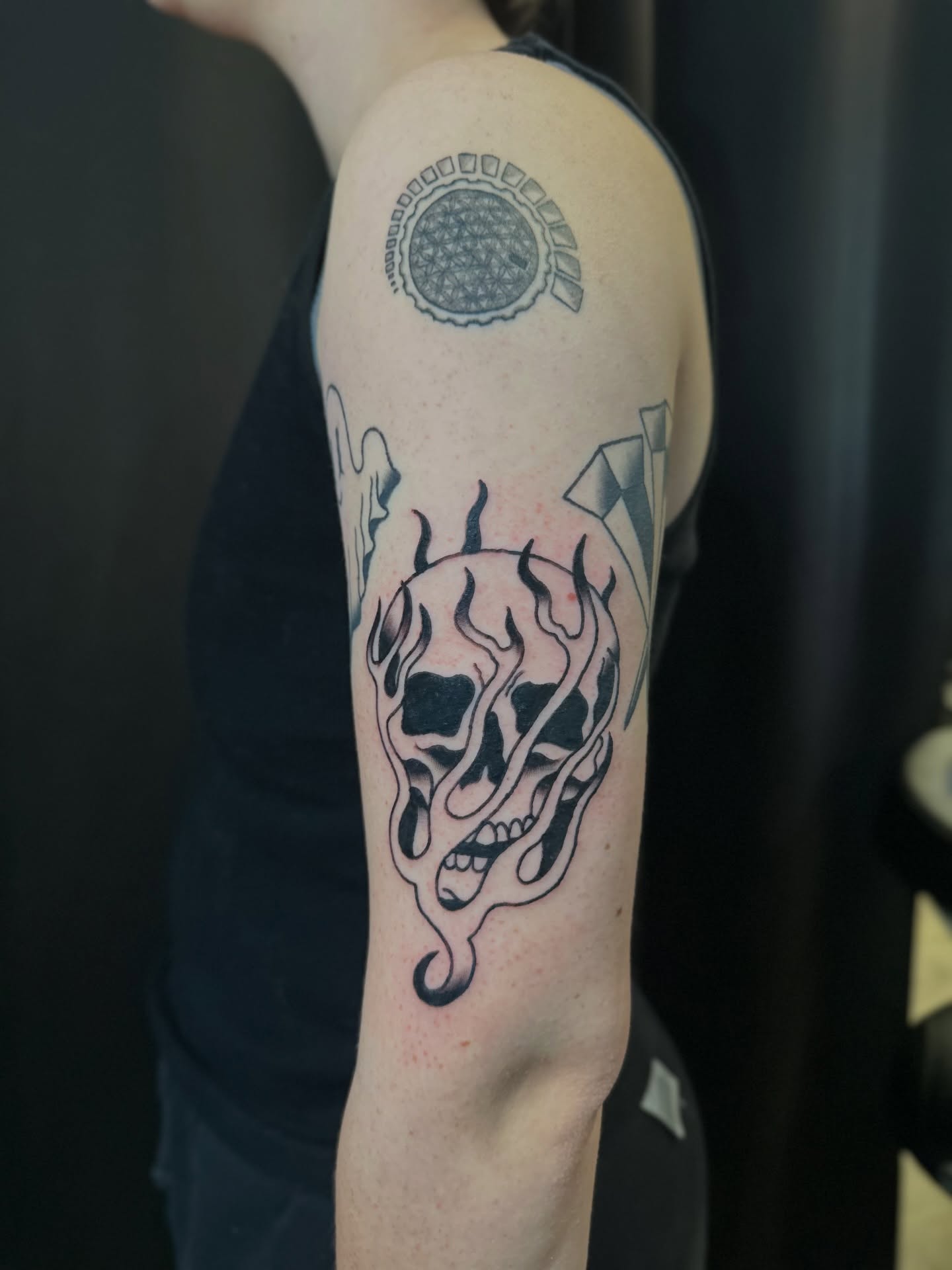 Floral skull black and grey tattoo on the forearm by Tyyler Santor (Tattoo Artist), Somerville, Massachusetts