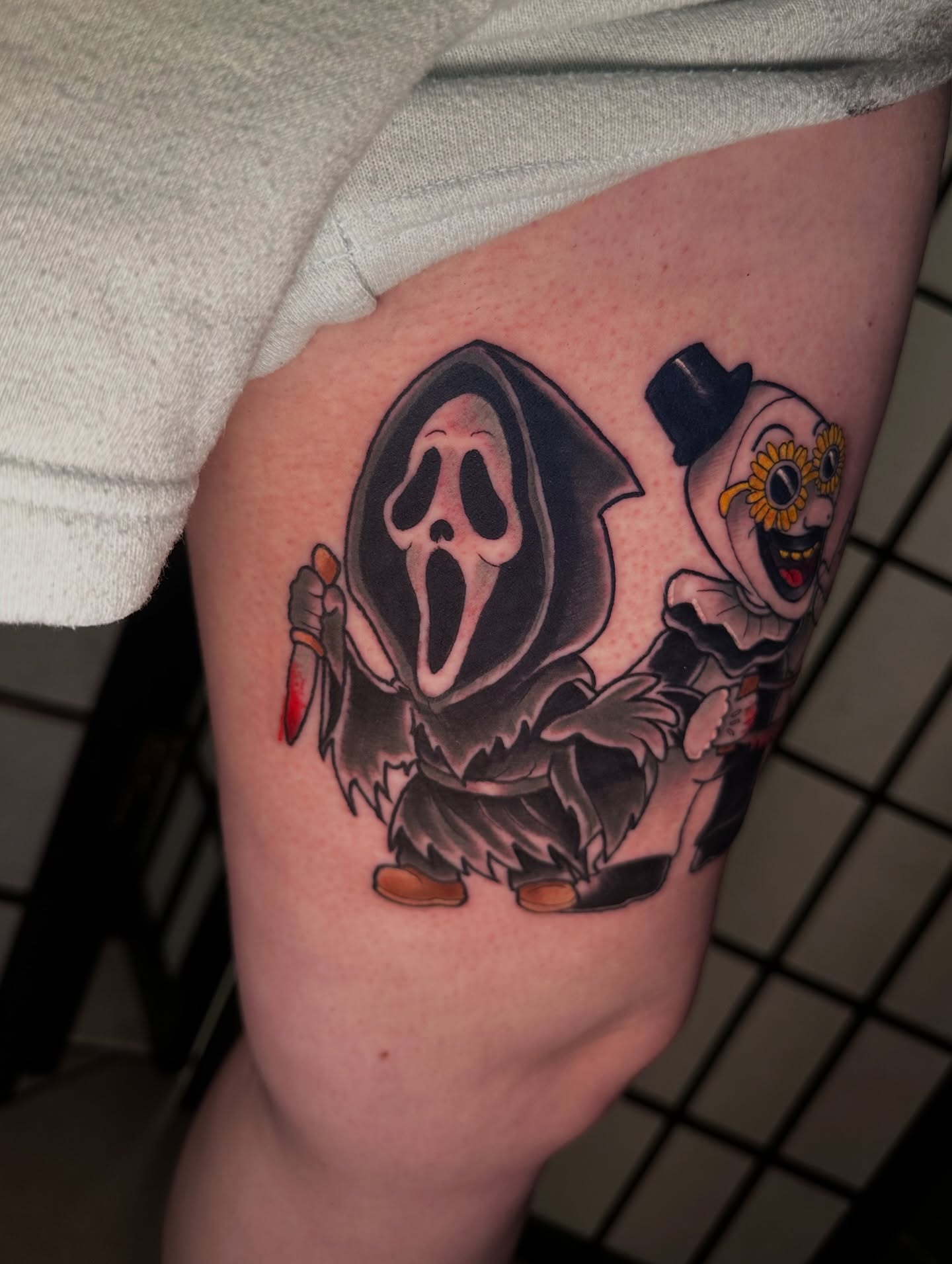 Grim Reaper and Clown realism tattoo on the thigh by Robert Douglas