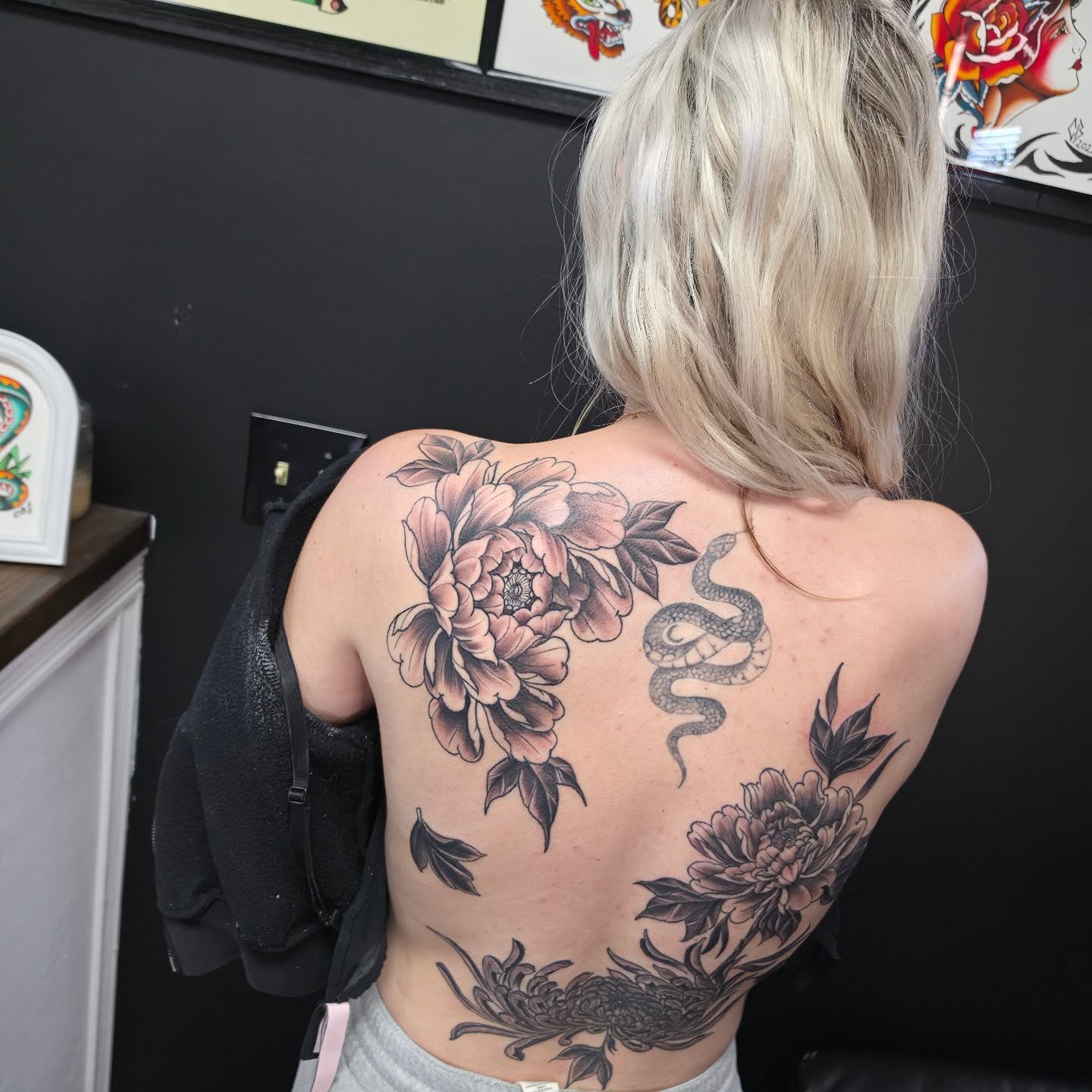 Peony and snake American traditional tattoo on the back by Robert Glover
