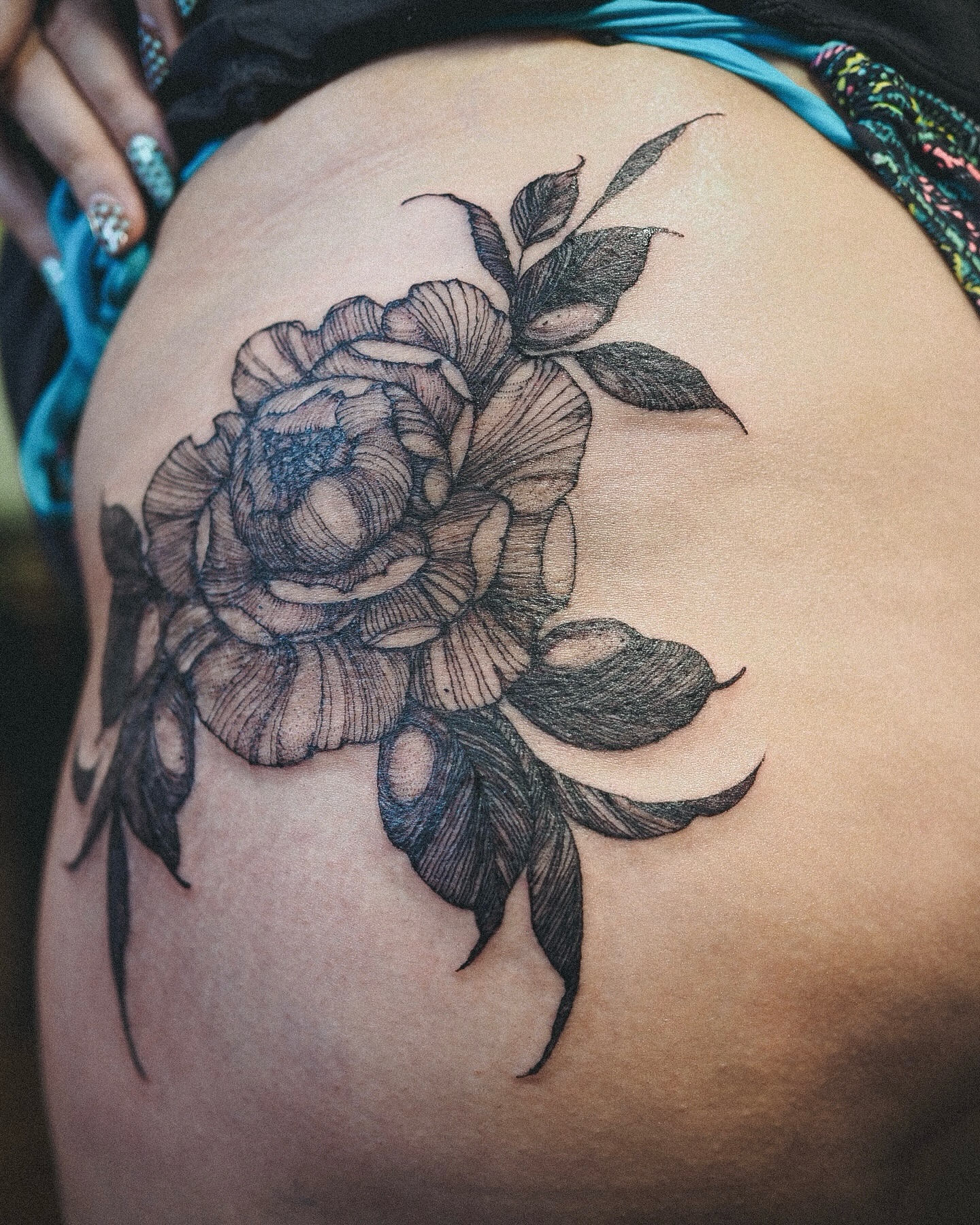 Peony black and grey tattoo on the thigh by Inks by Nastia