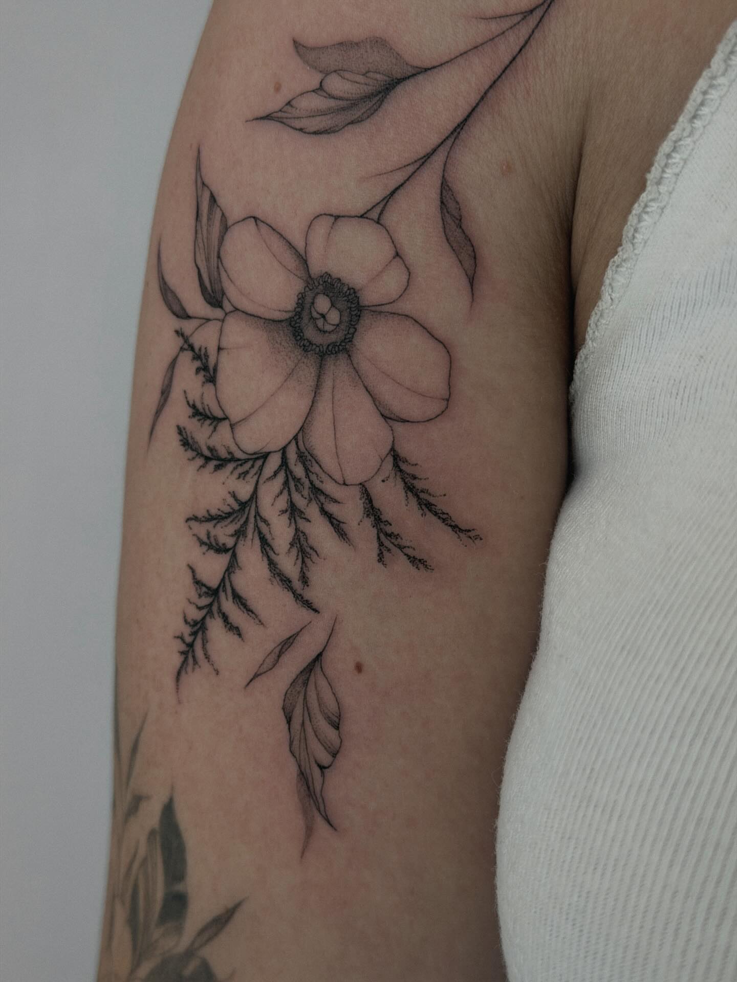 Flower black and grey tattoo on the forearm by Hannah Matthews