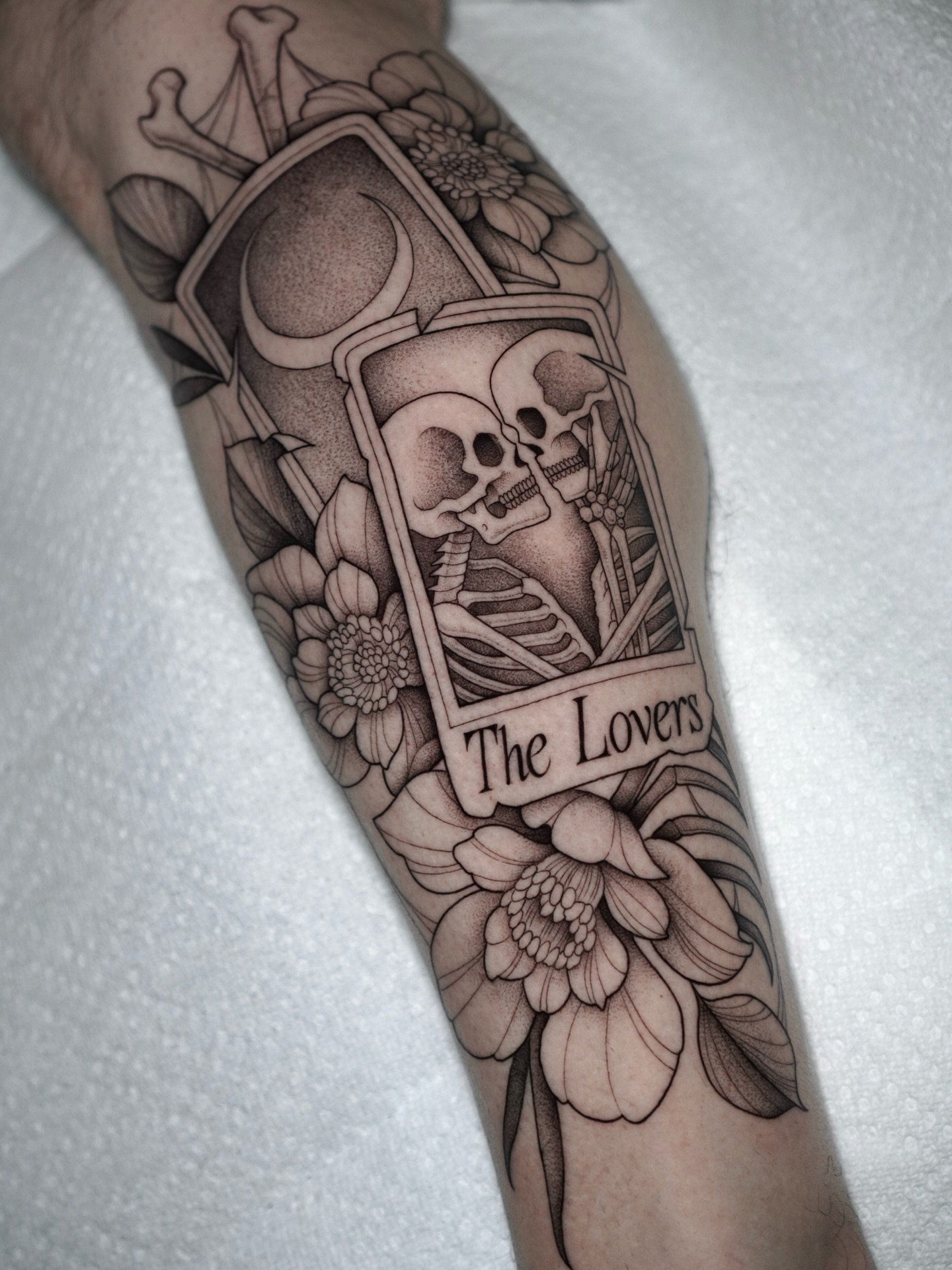 The lovers tarot card dotwork tattoo on the forearm by Carlos Abad