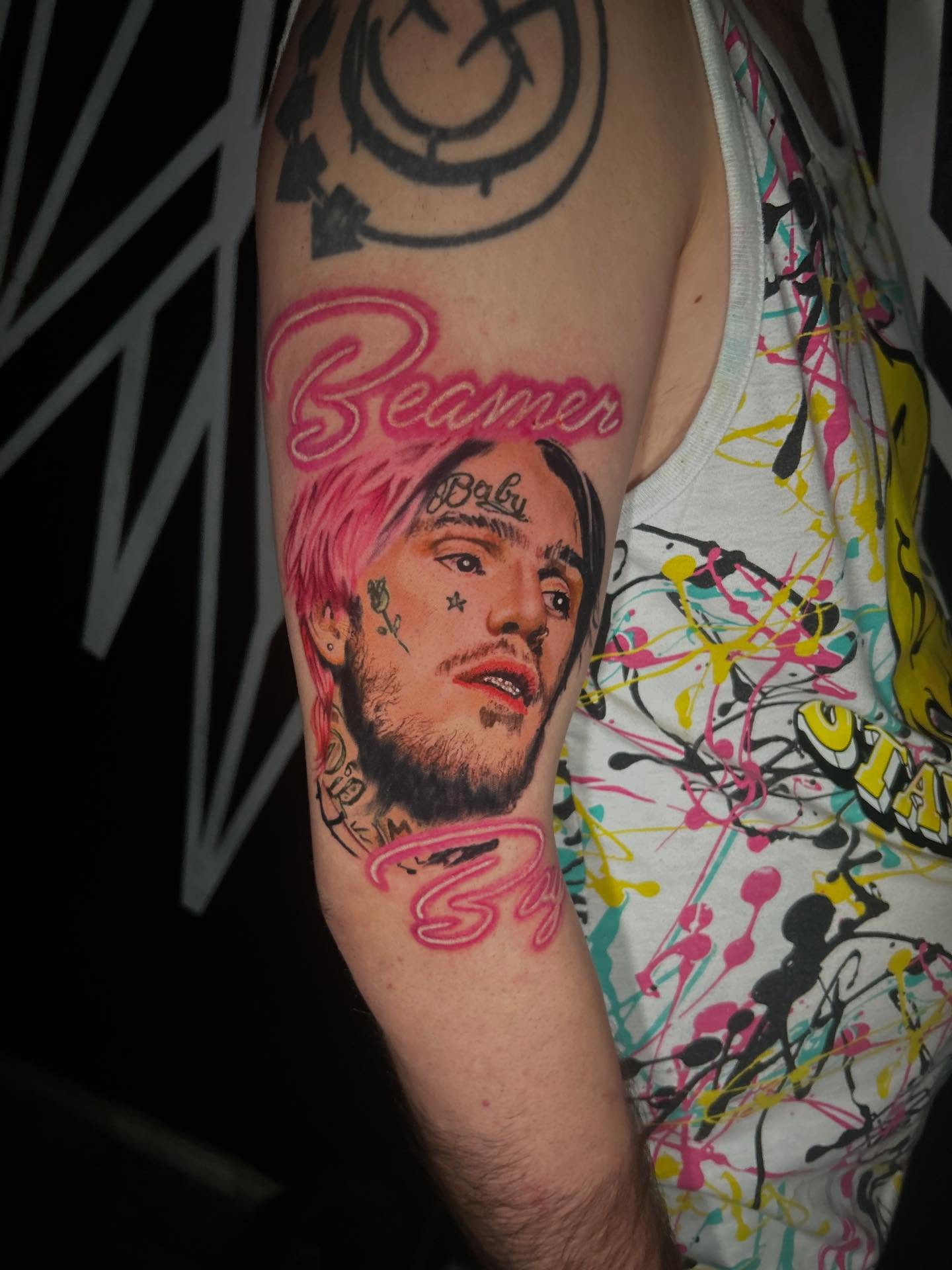 Portrait realism tattoo on the forearm by Sean Cavanaugh