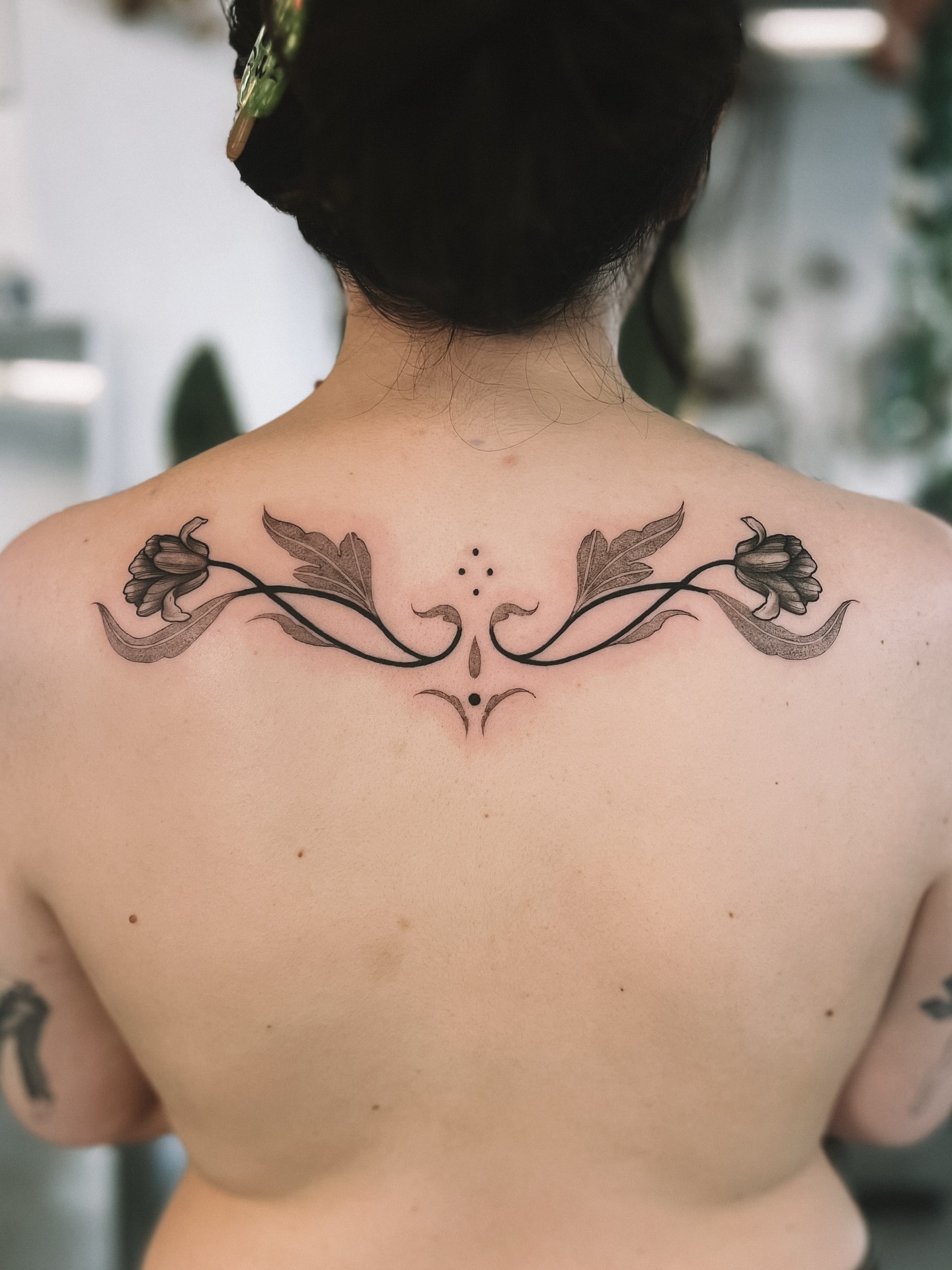 Floral vine ornamental tattoo on the back by sebs phạm, Los Angeles, California