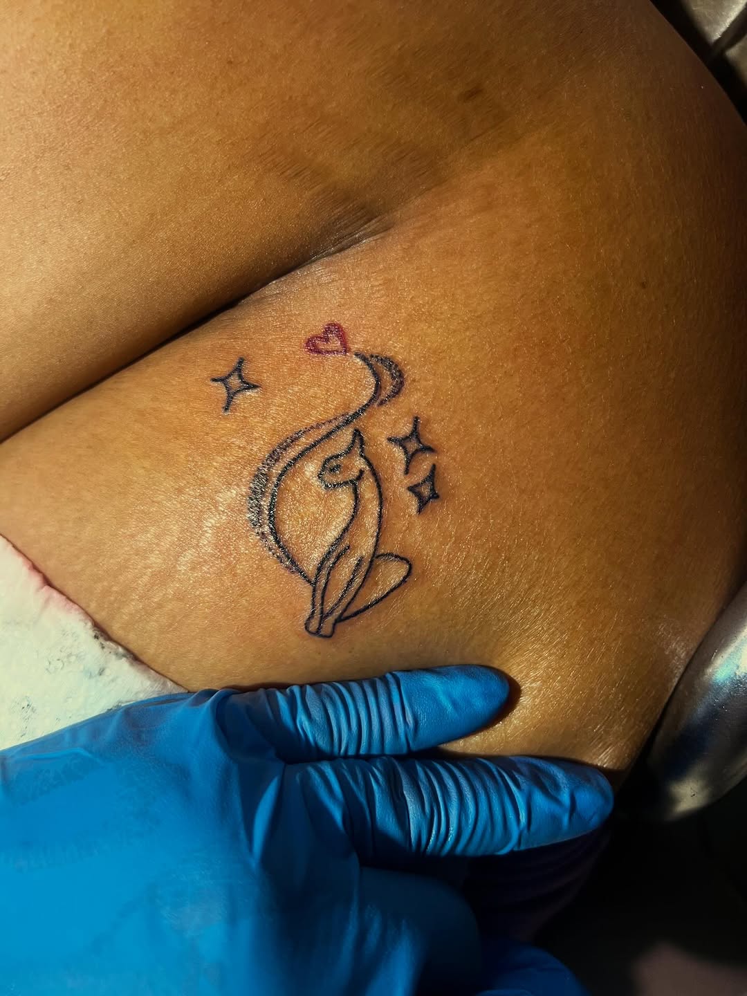 Cat with heart and stars tattoo on the thigh by Deangelo Inkcrazy Dukes
