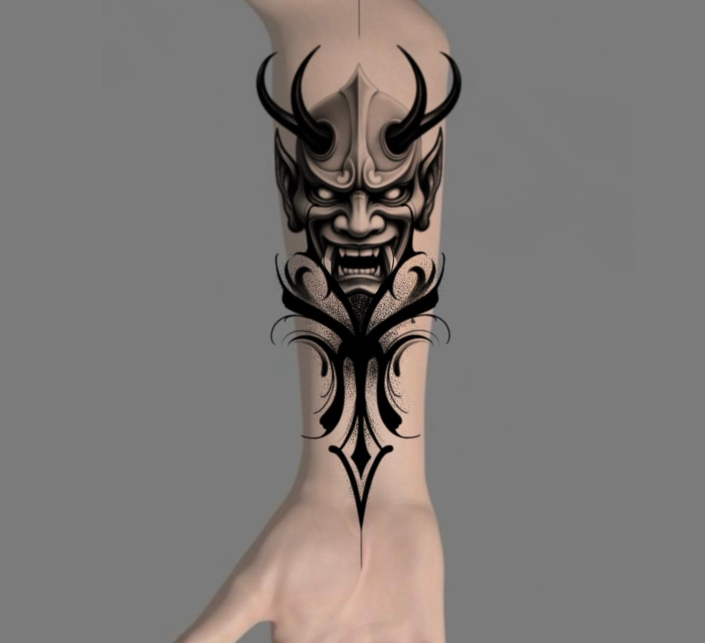 Demon mask tribal tattoo on the forearm by Sebastián Vallejo
