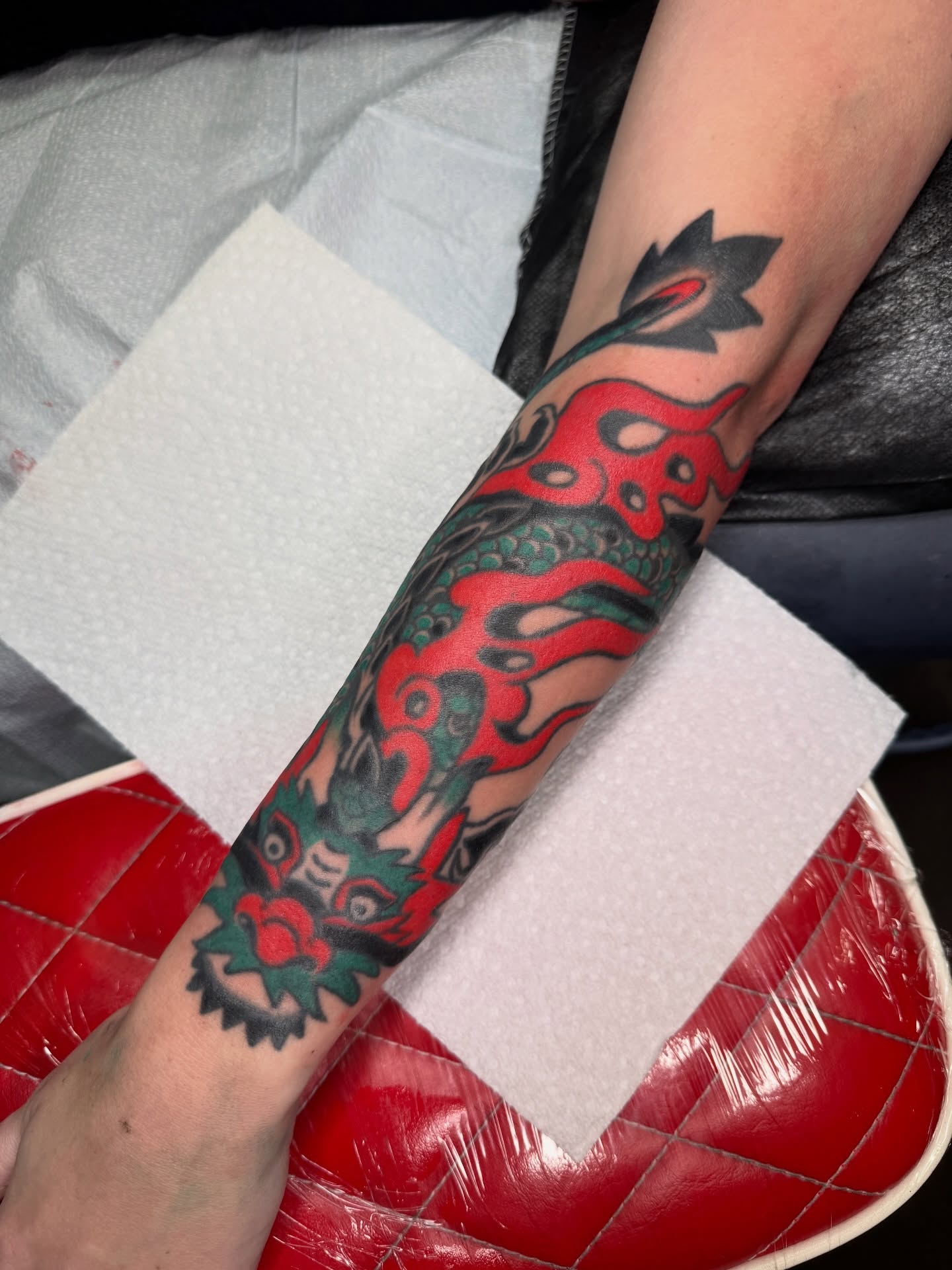 Dragon and rose American traditional tattoo on the forearm by lily gustave i tattoo