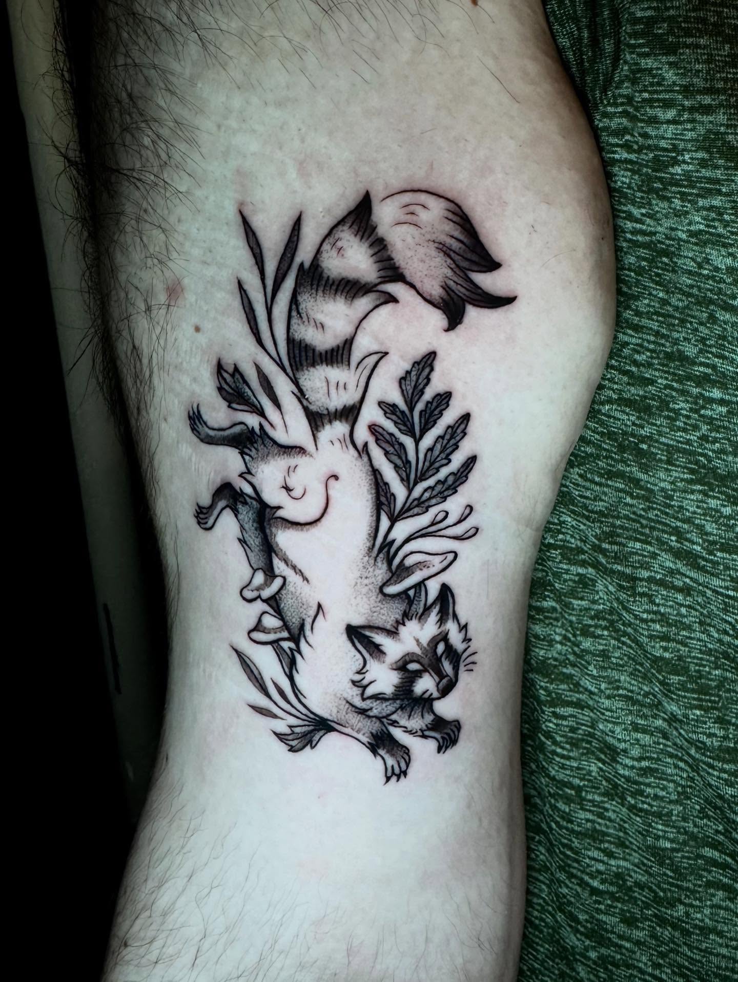 Cat and fish black and grey tattoo on the forearm by Morgan Peeples