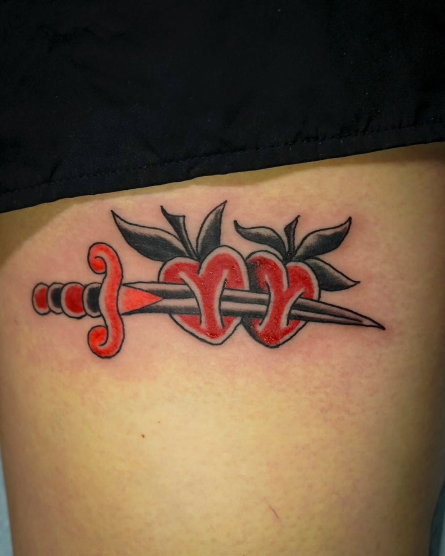 Sword and roses American traditional tattoo on the thigh by Spicoli