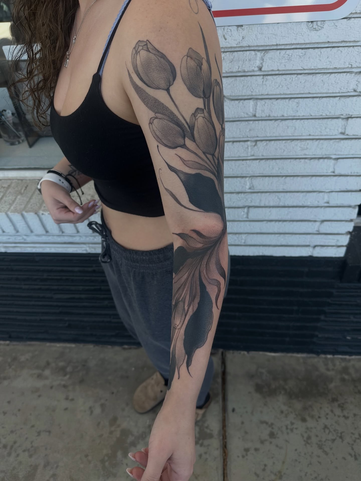 Tulips black and grey tattoo on the forearm by Juan Vega (tony)