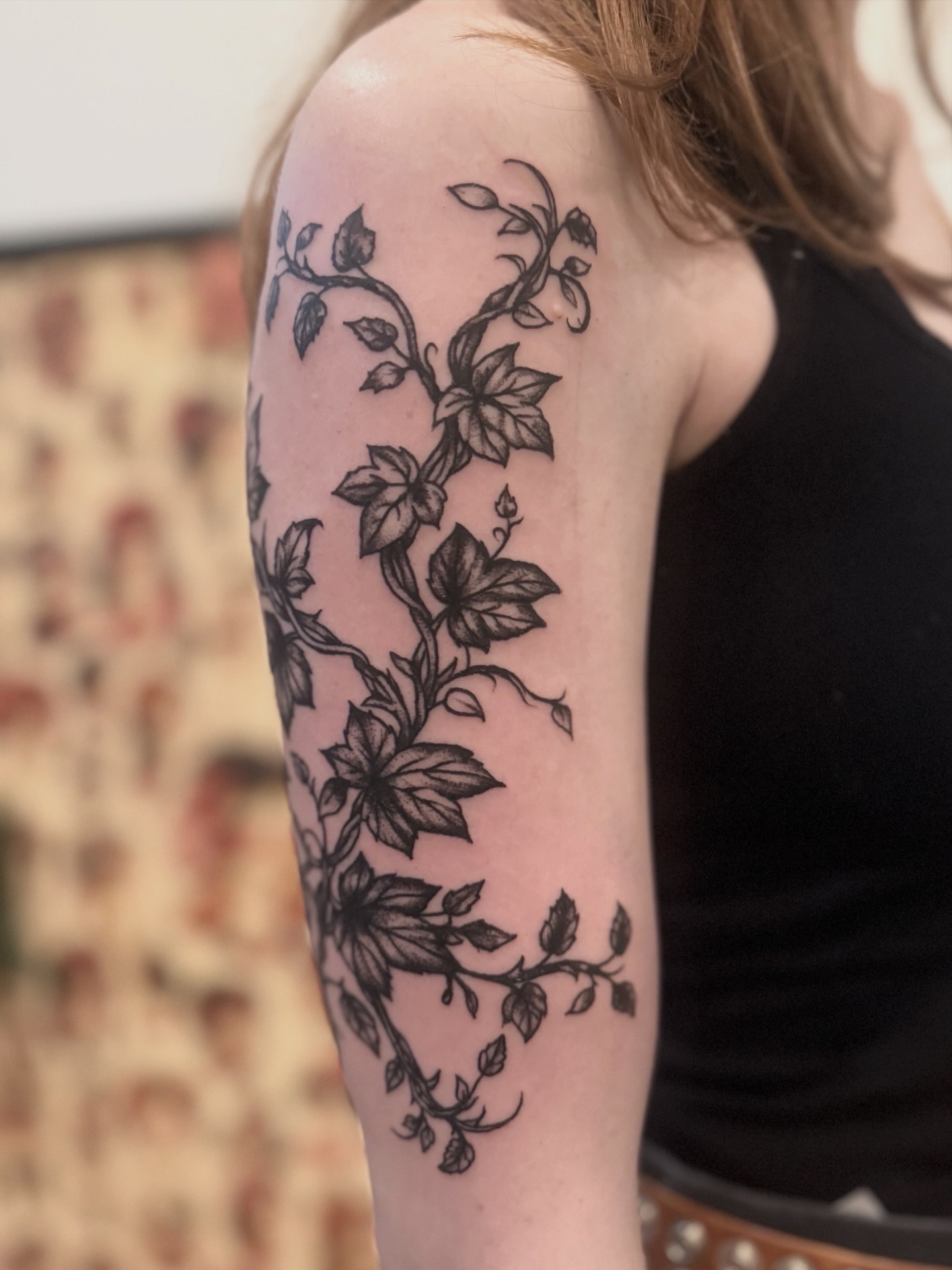 Vines and leaves black and grey tattoo on the upper arm by Tattoo Artist, Philadelphia, Pennsylvania