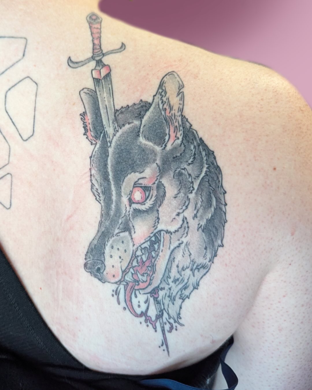 Wolf dark realism tattoo on the shoulder by Lepus