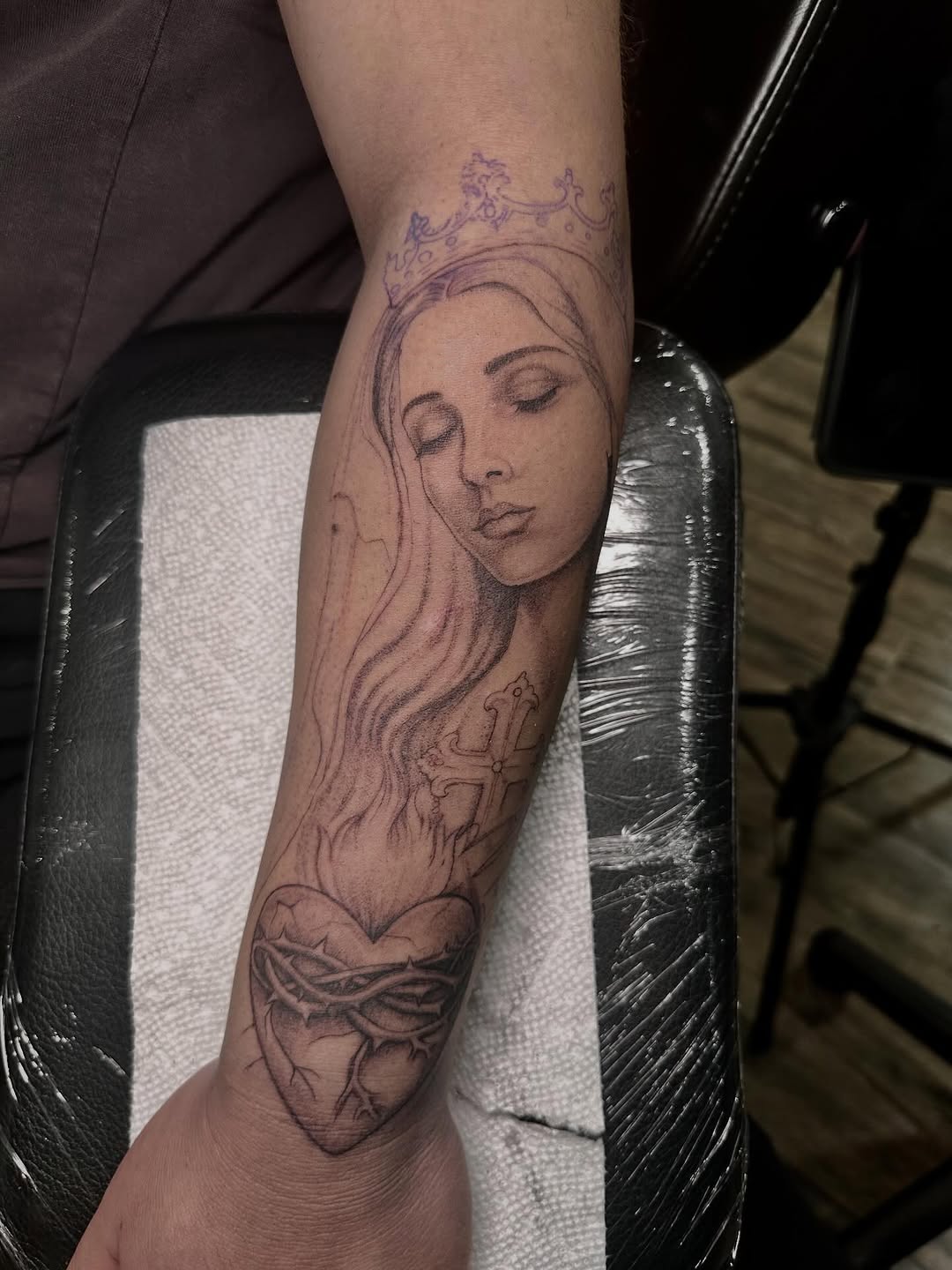 Sacred heart with crown and cross Chicano tattoo on the forearm by 𝐒𝐡𝐞𝐫𝐥𝐥𝐲