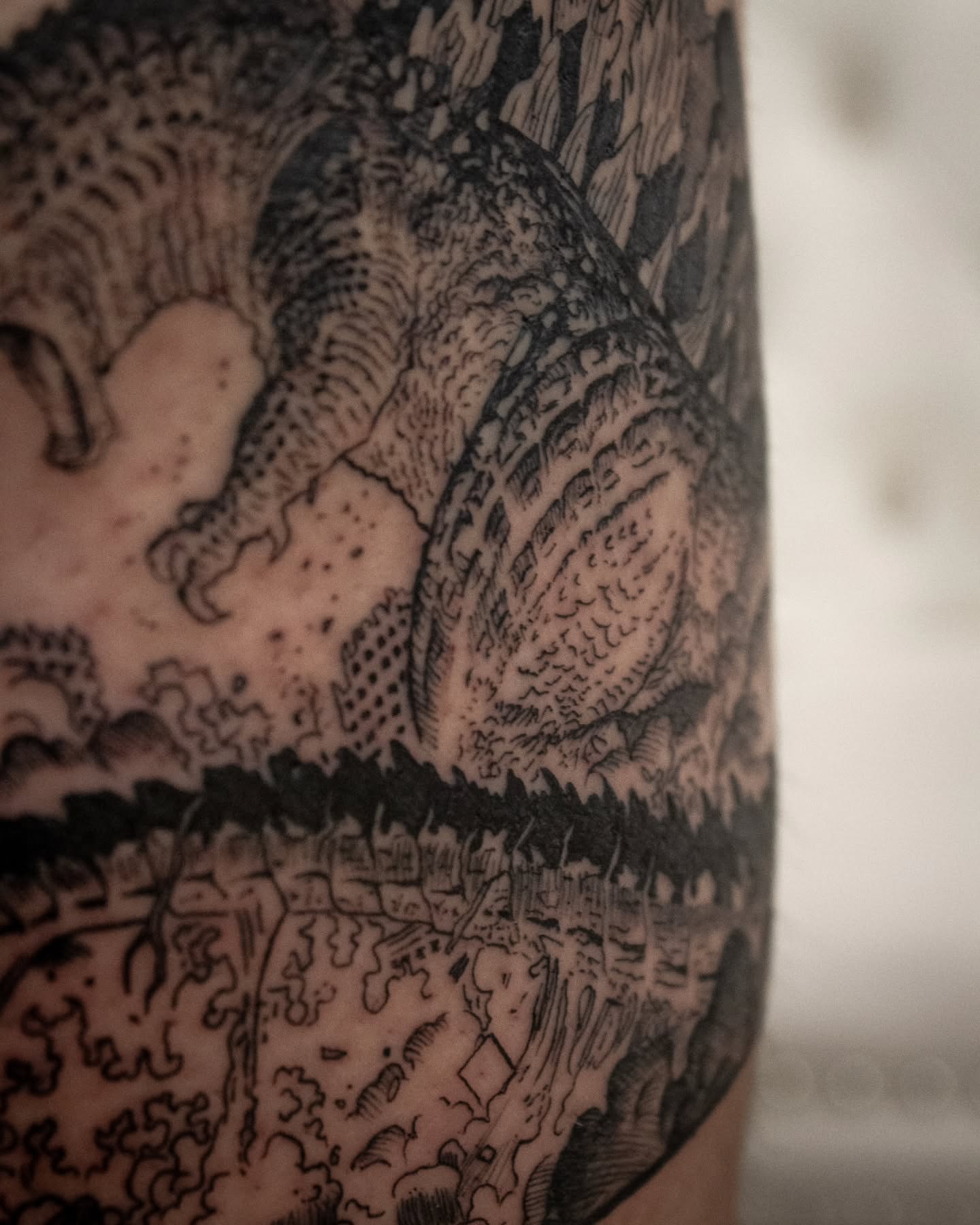 Dragon black and grey tattoo on the forearm by Erik Bonilla