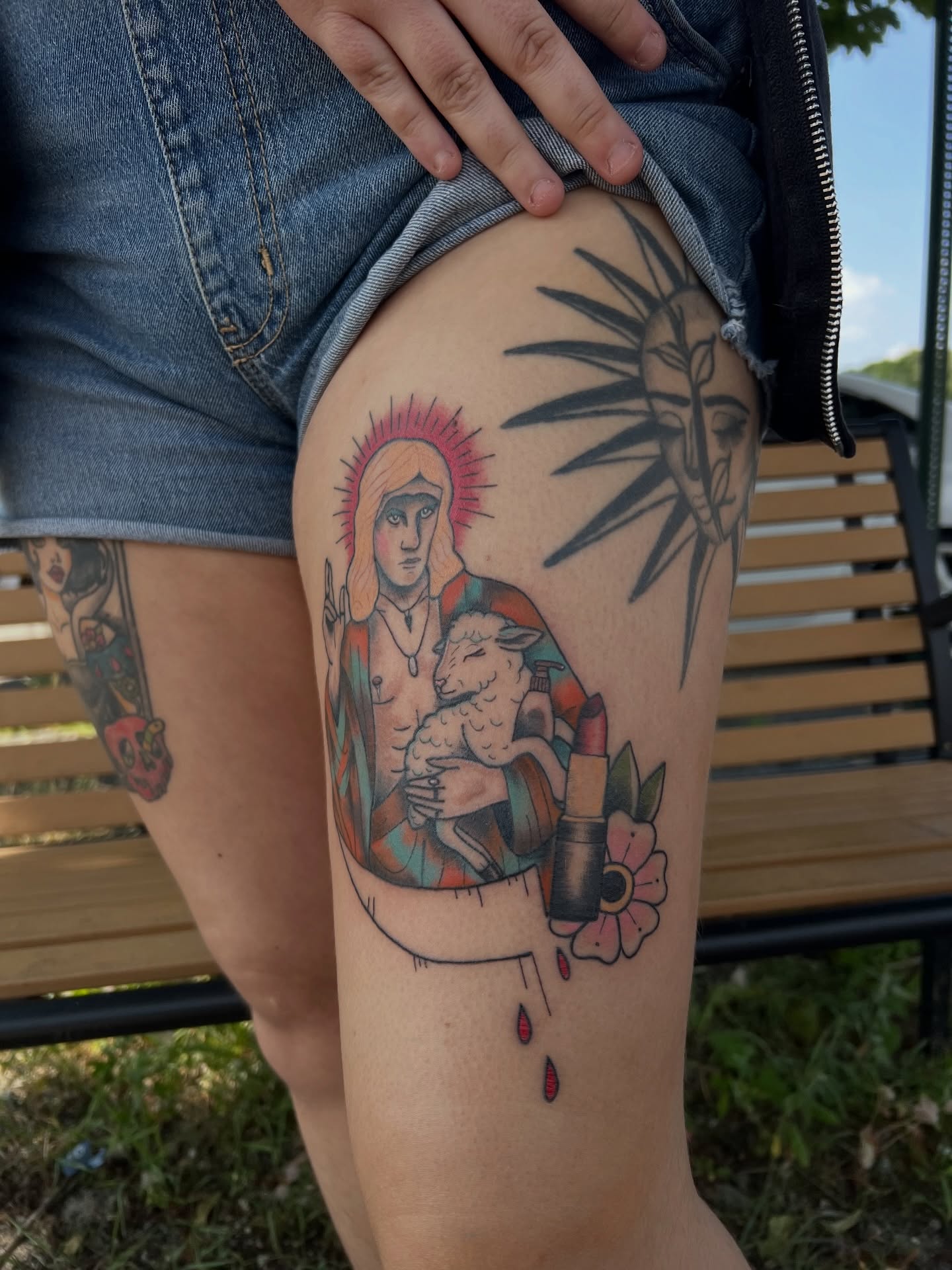 Religious figure with lamb American traditional tattoo on the thigh by kobeigh