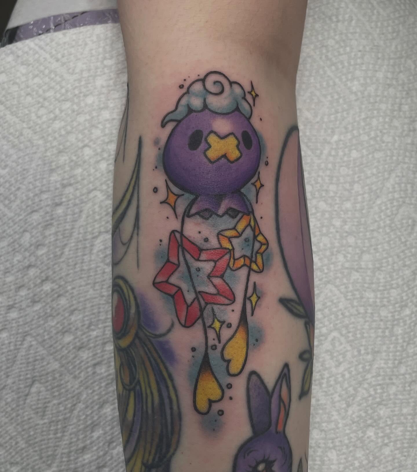Space creature new school tattoo on the forearm by Fionna Fanning