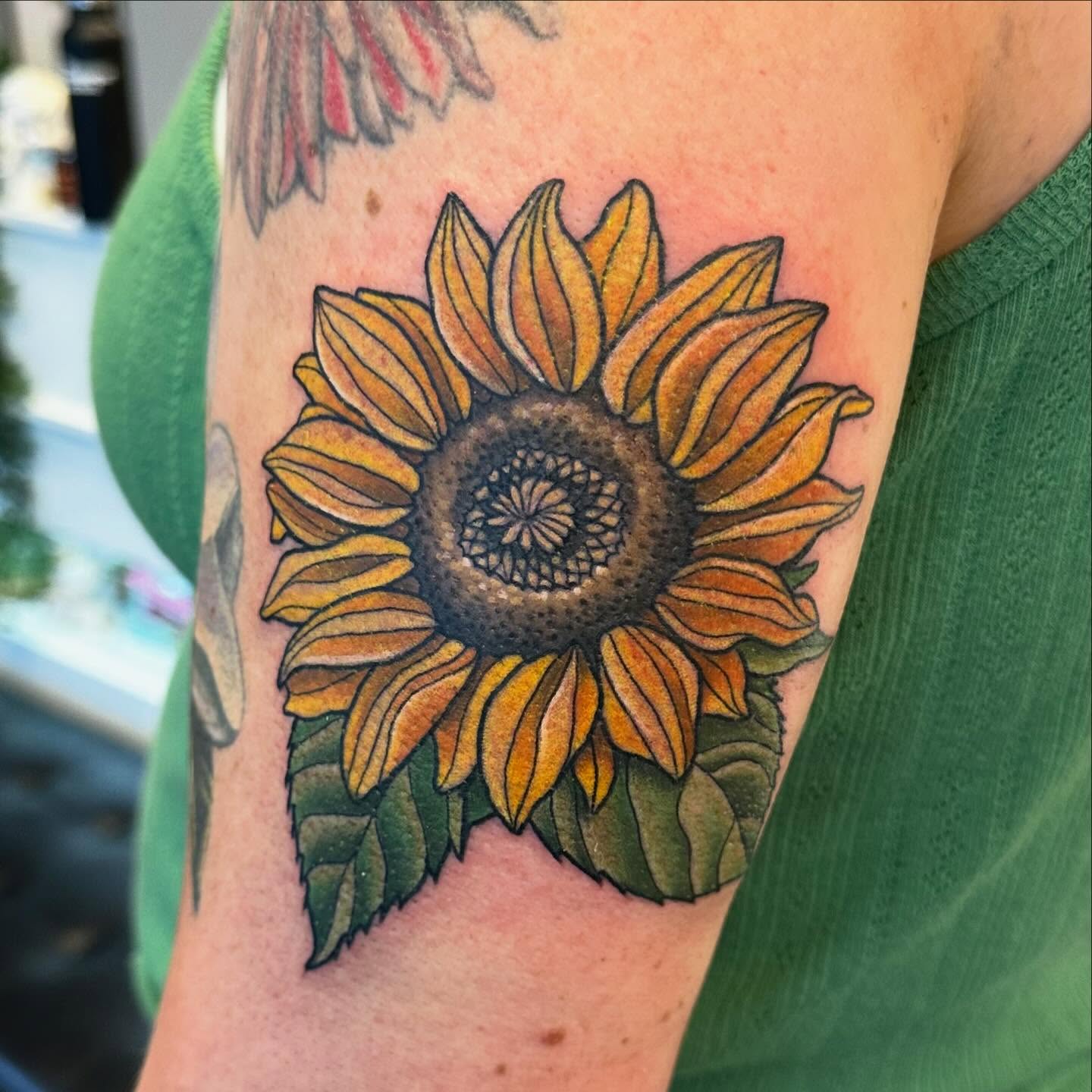 Sunflower realism tattoo on the forearm by Katie Beth