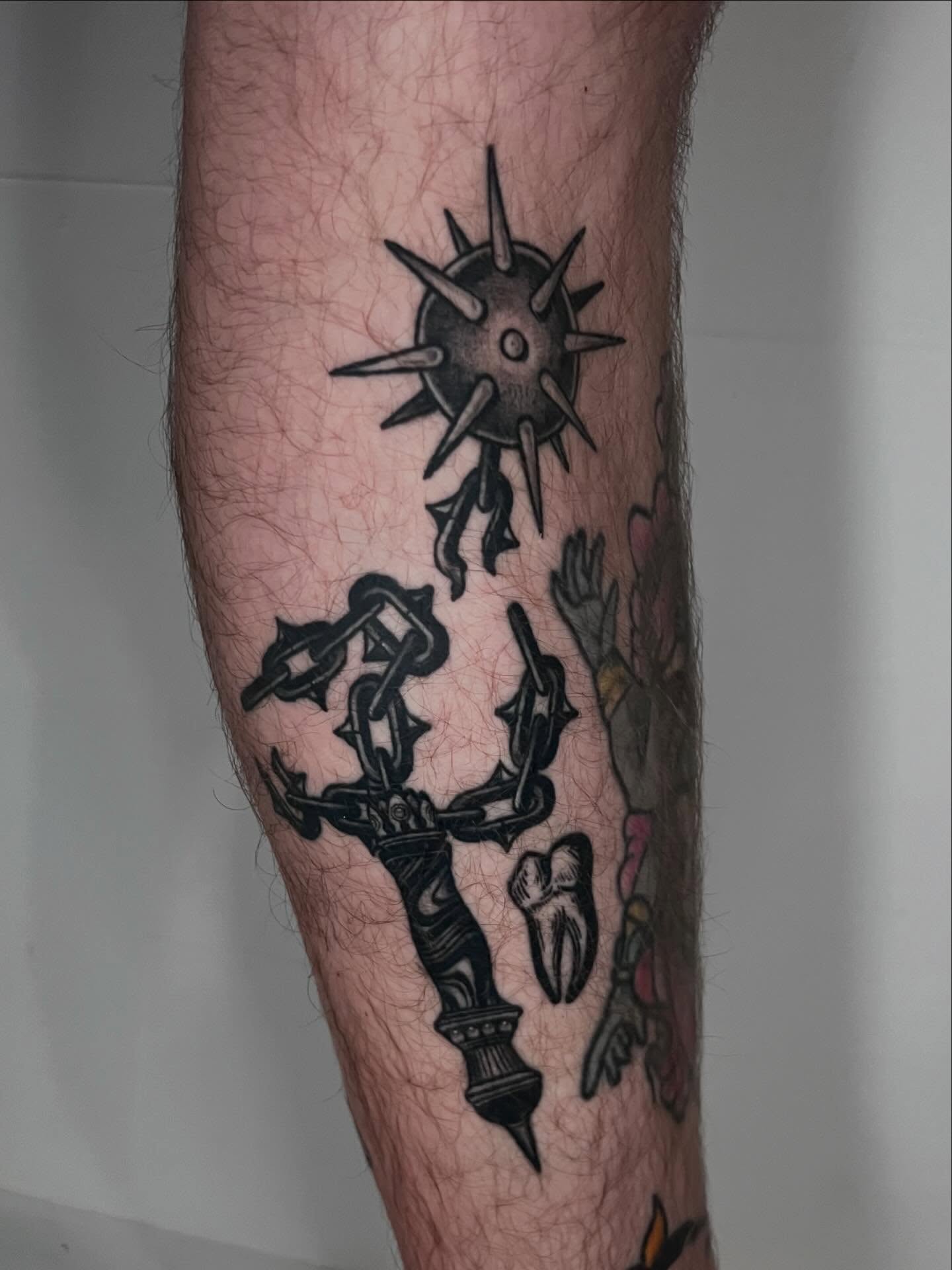 Scorpion and sun black and grey tattoo on the forearm by Eoghann McGregor