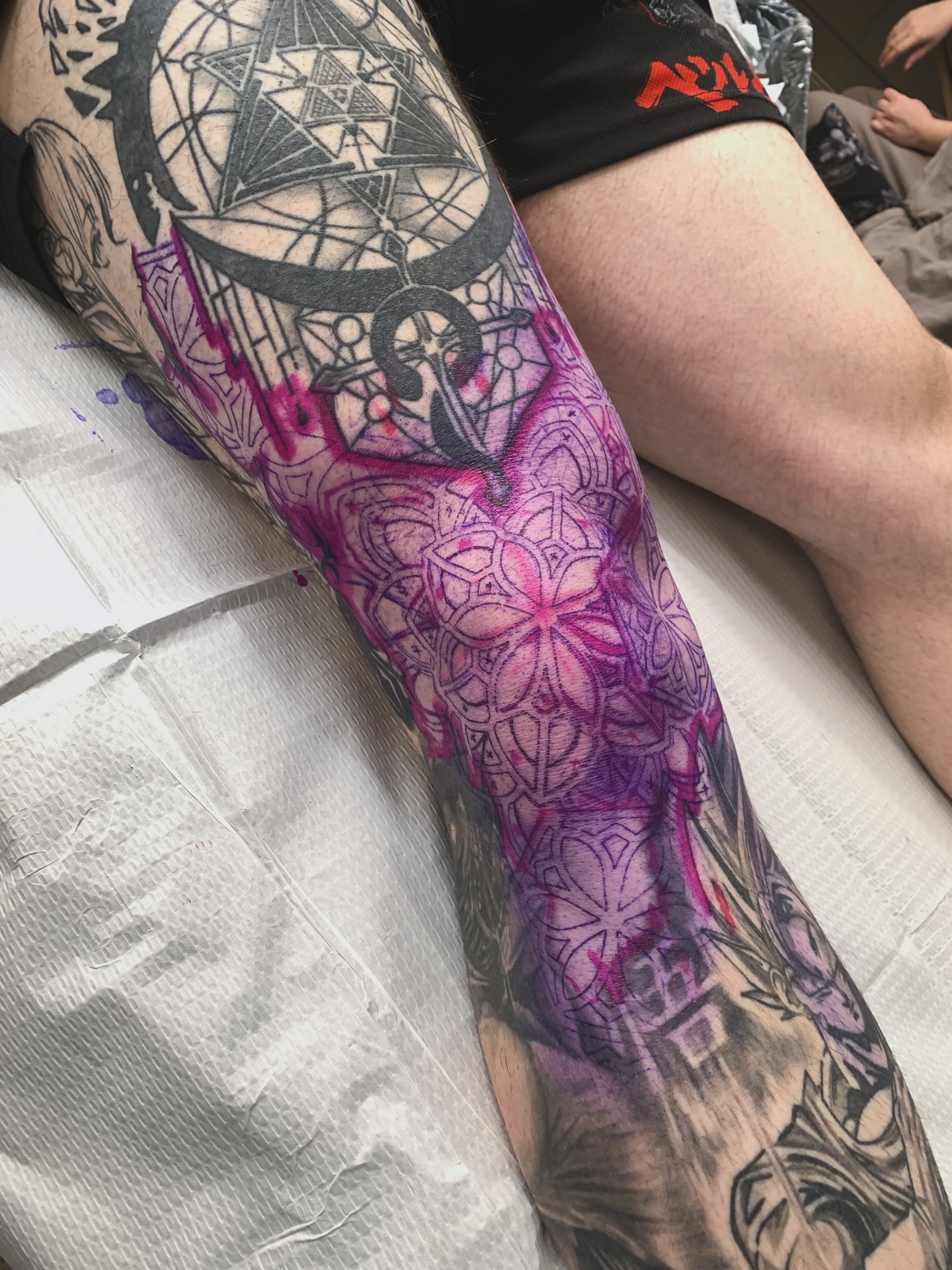 Mandala geometric tattoo on the leg by Riley