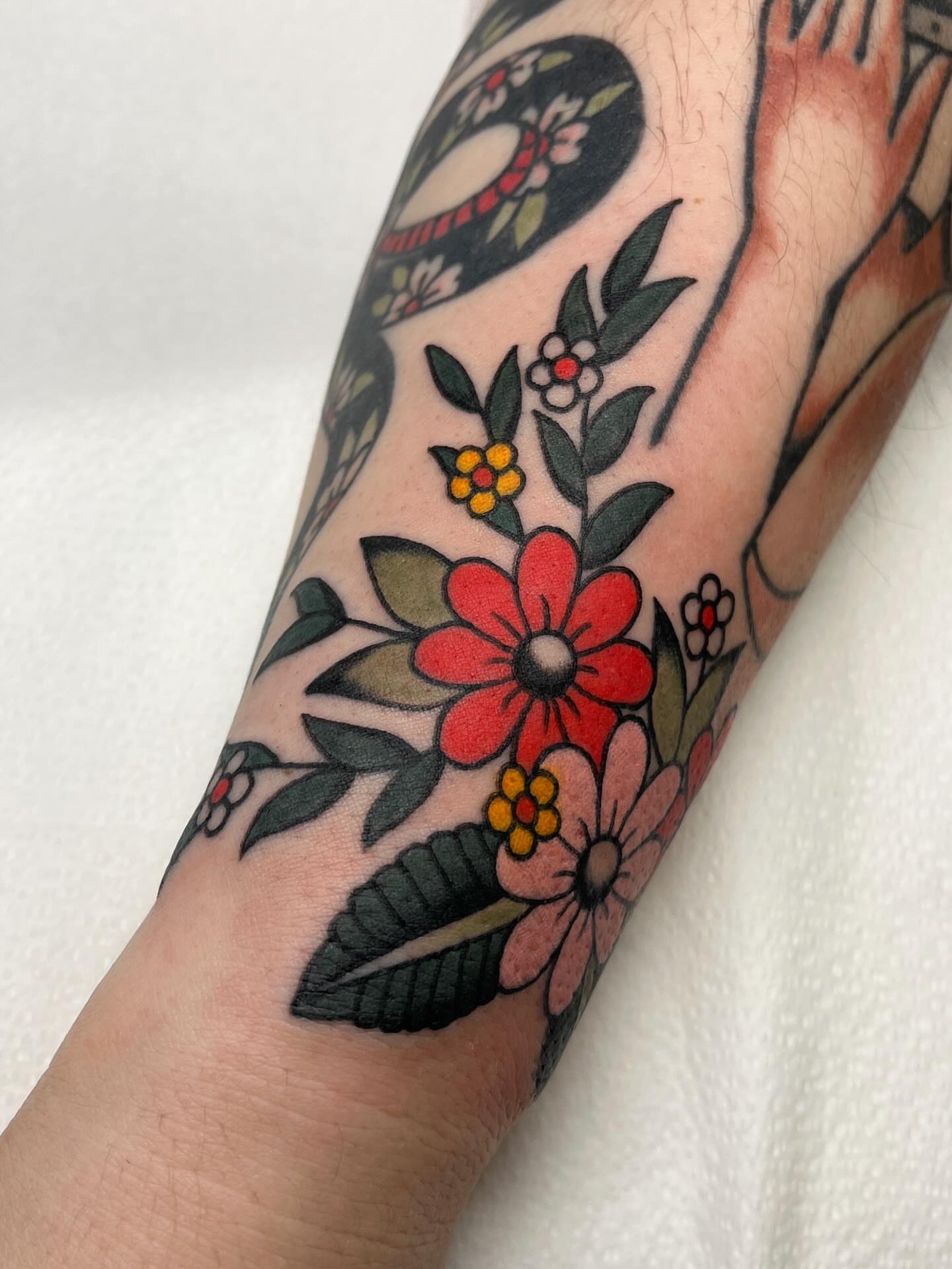 Floral arrangement American traditional tattoo on the forearm by 🌞all Bodies Welcome🌞