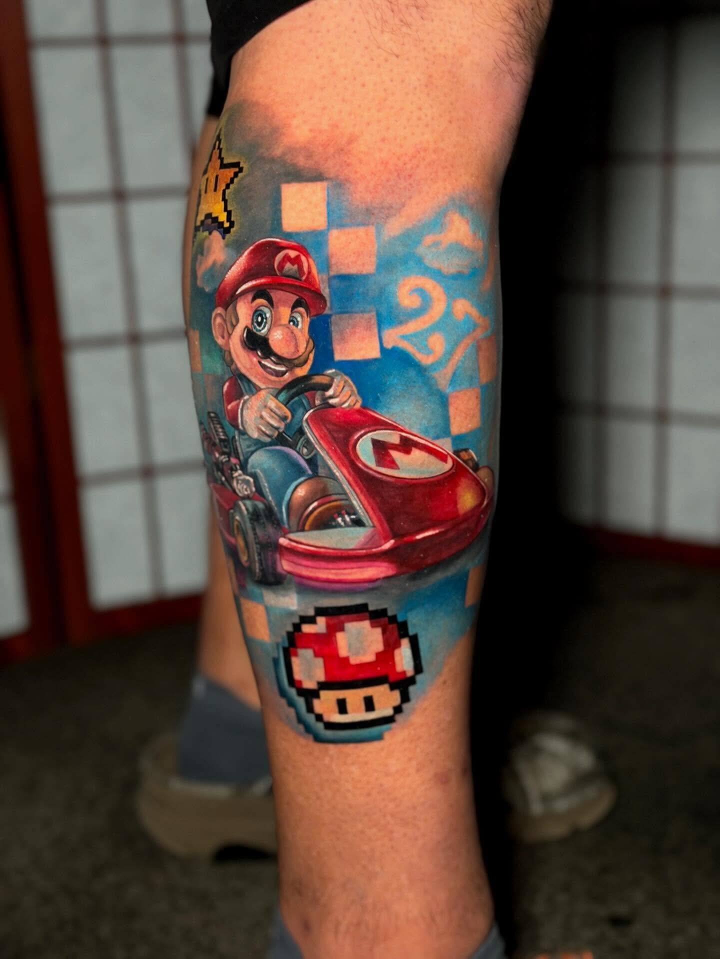 Mario Kart realism tattoo on the forearm by Johnny Scillieri
