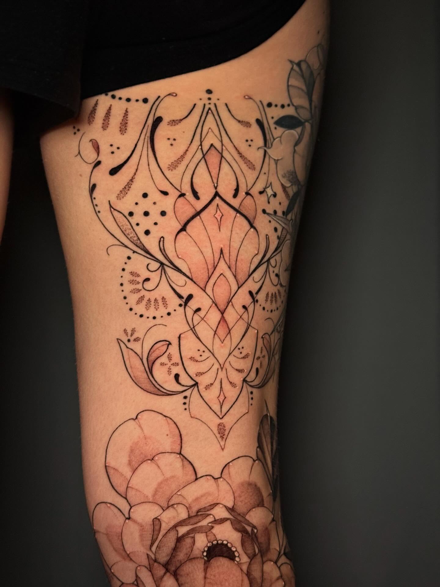 Lotus and floral dotwork tattoo on the thigh by Andreanna Rosemarie Gabranidis, Pennsauken, New Jersey