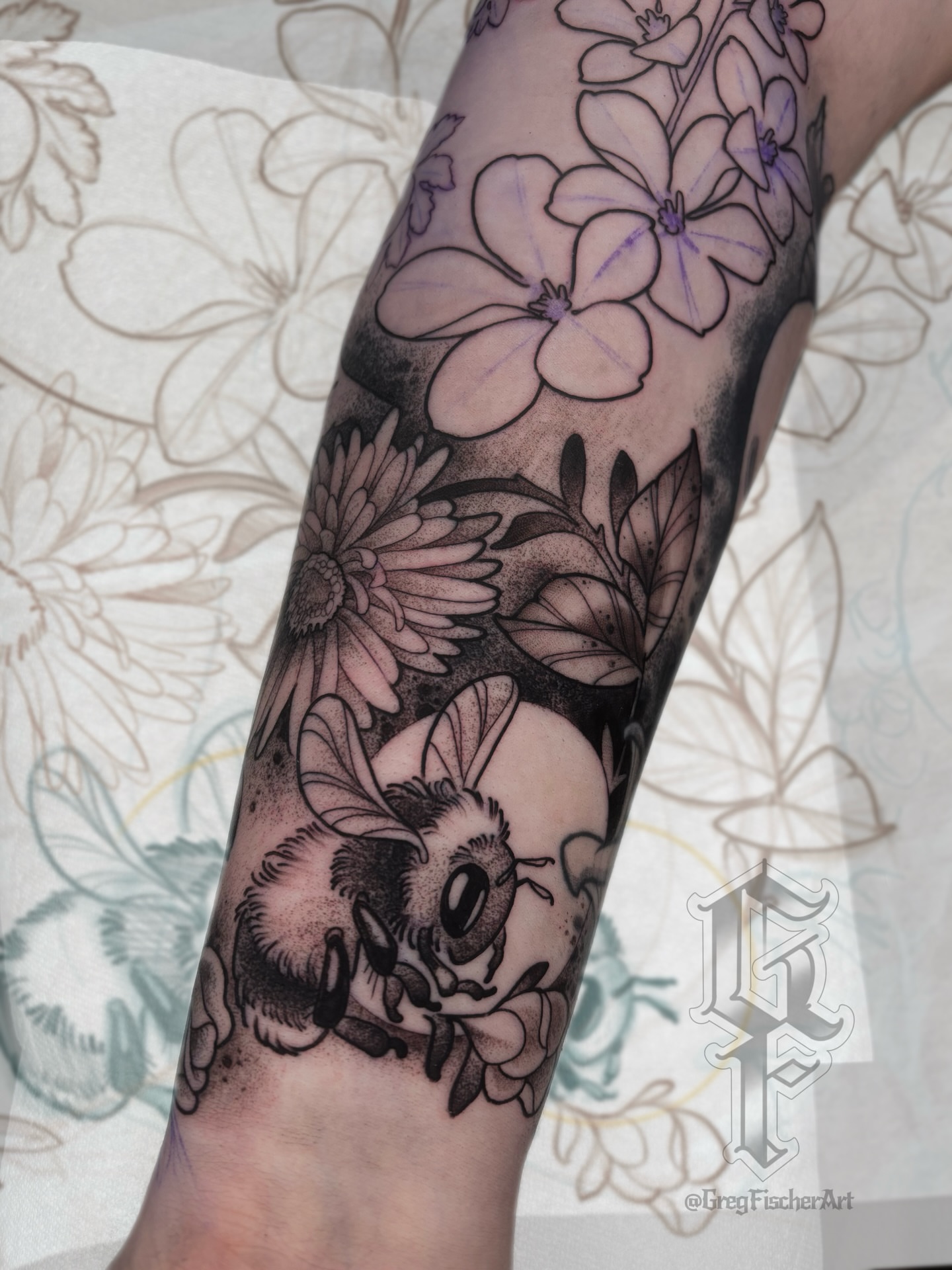 Bee and flowers dotwork tattoo on the forearm by Greg Fischer