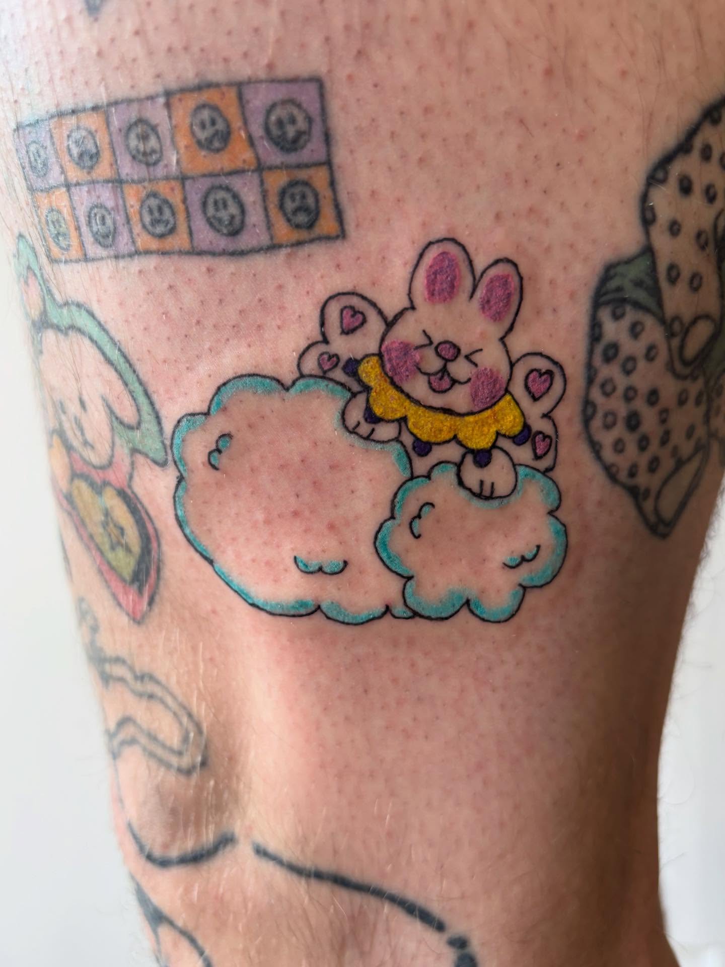 Rabbit on cloud new school tattoo on the forearm by riley
