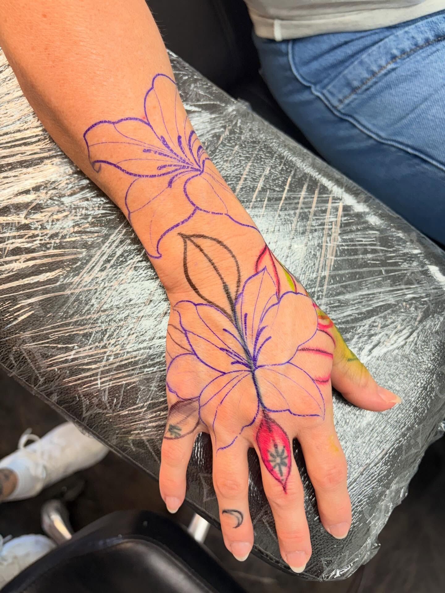 Lily new school tattoo on the hand by Avery Mullins