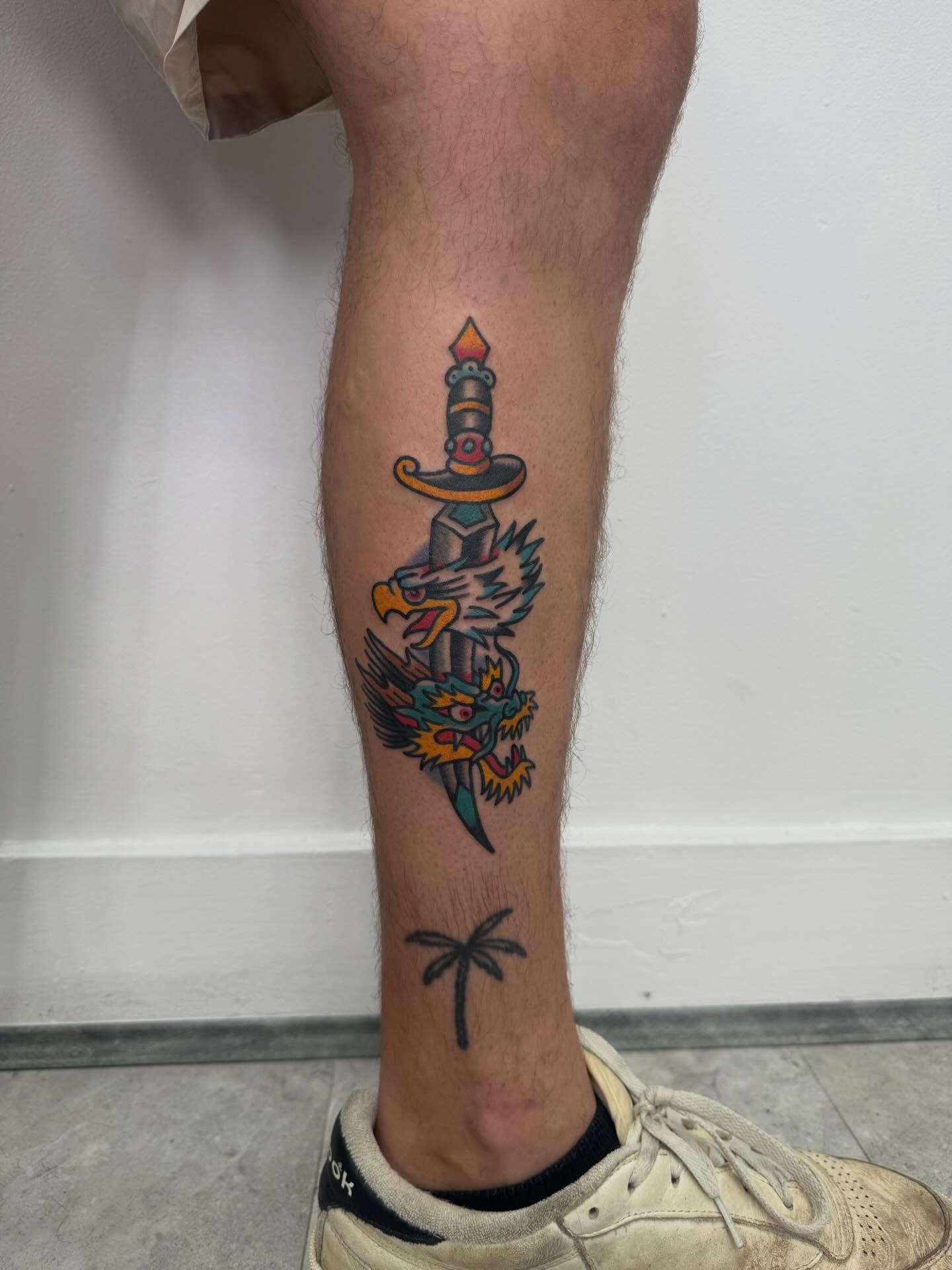 Sword and eagle American traditional tattoo on the calf by Oldschool Tattooer