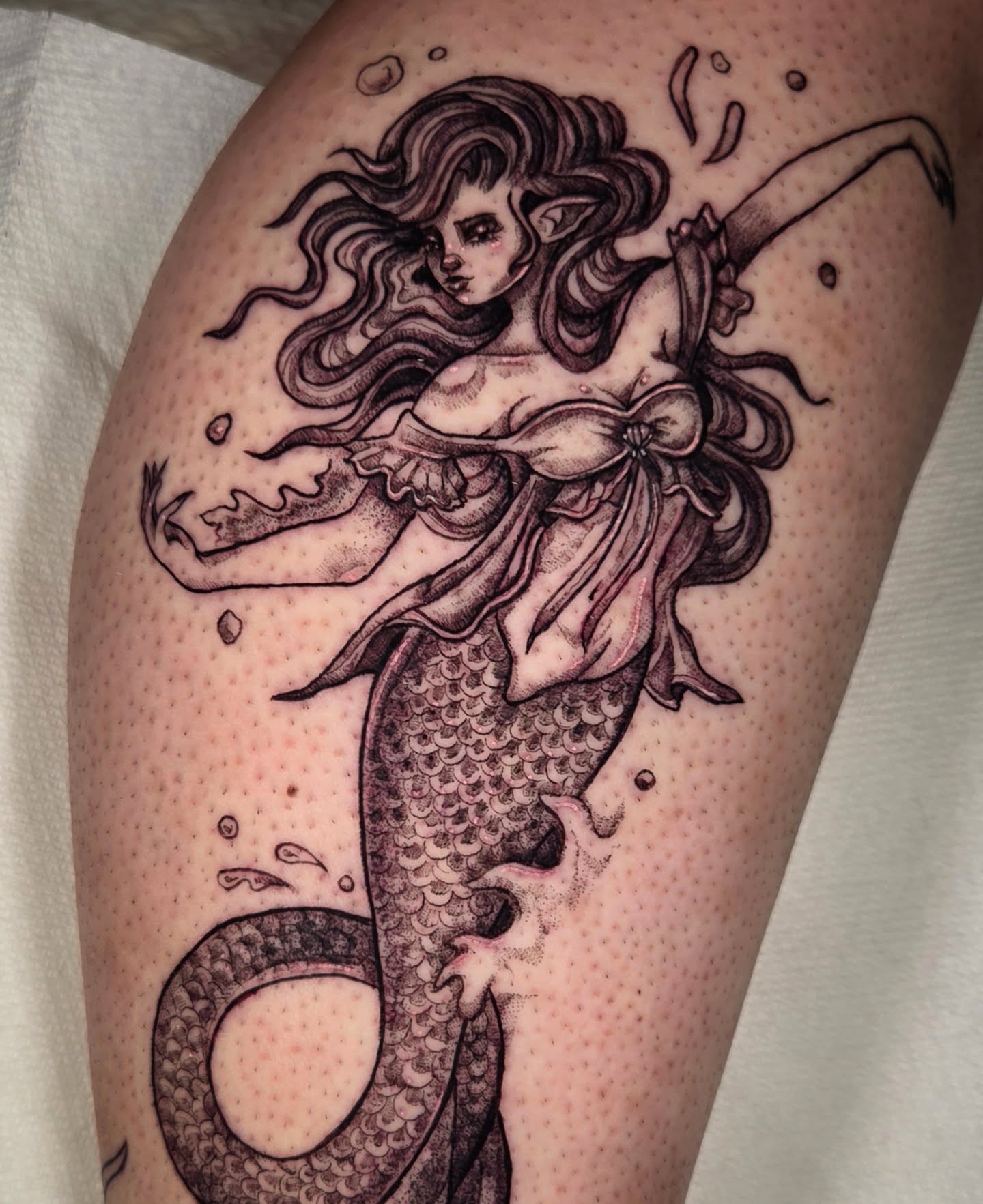 Mermaid dotwork tattoo on the thigh by Devin 🖤