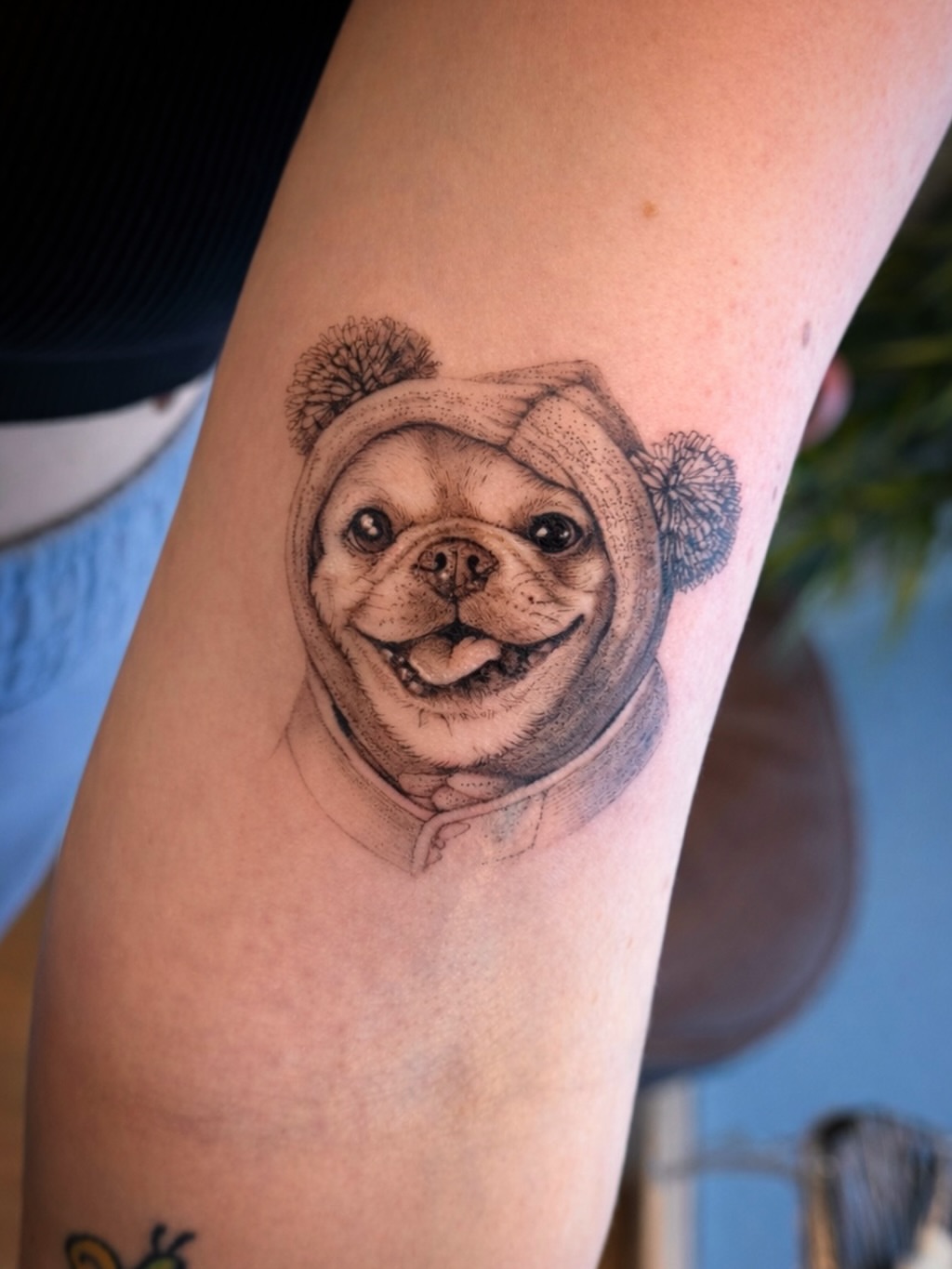 Pug wearing hat realism tattoo on the forearm by Aristova Anastasia