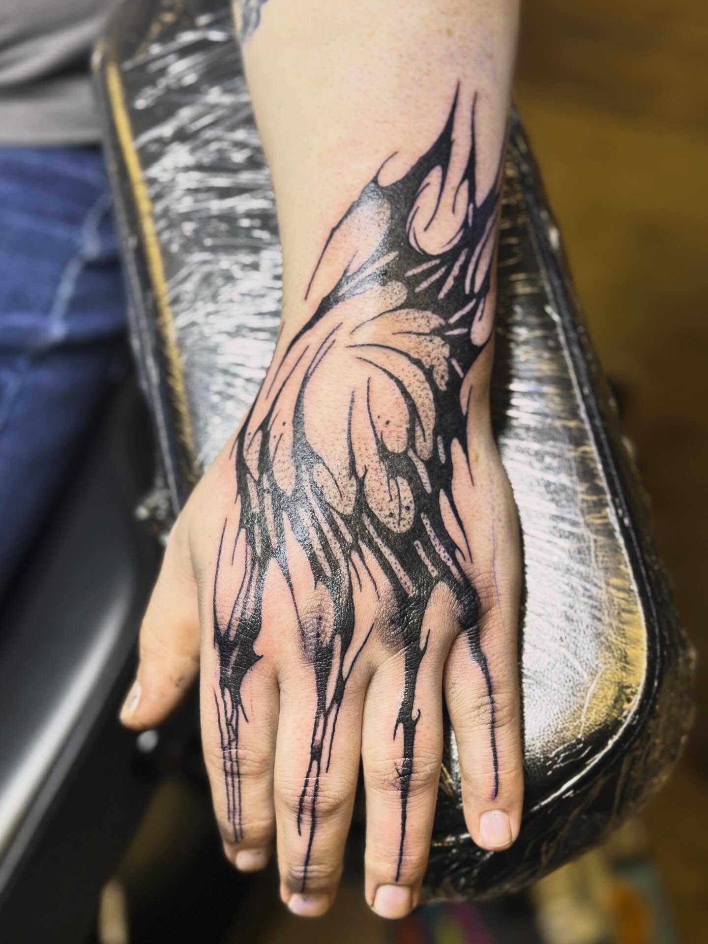 Flame black and grey tattoo on the hand by Joshua Ware, Alvarado, Texas