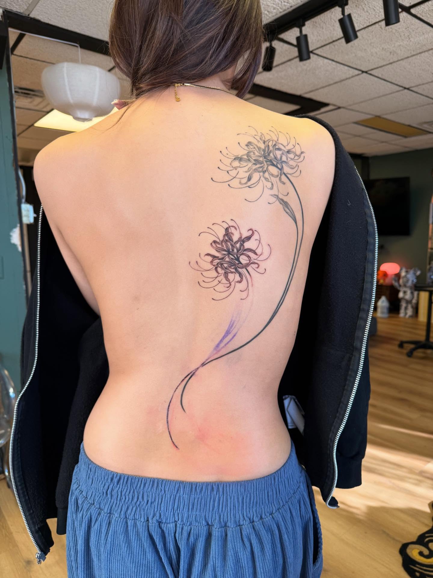 Chrysanthemum fine line tattoo on the back by Nicki Yến