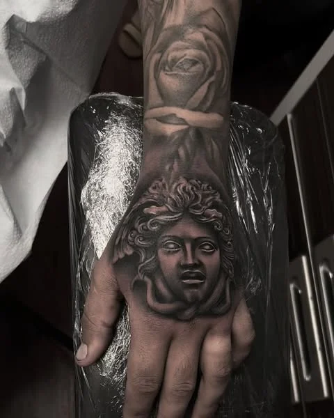 Medusa head realism tattoo on the hand by Magdalena Davis