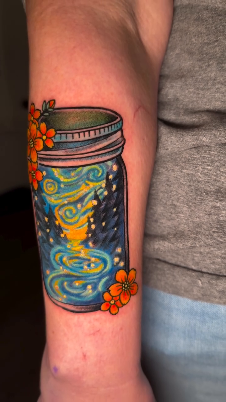Jar with Starry Night sky watercolor tattoo on the forearm by Kimberly Parton- Chapel Hill Tattooer, Chapel Hill, North Carolina