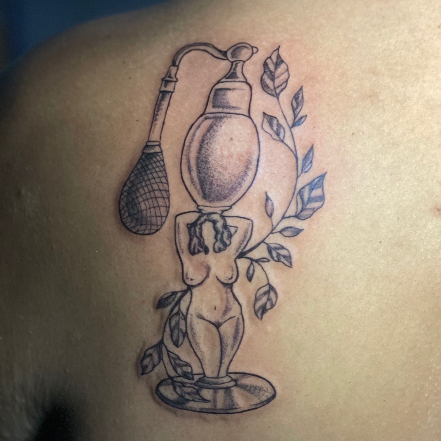 Statue with lamp dotwork tattoo on the shoulder by Brandie