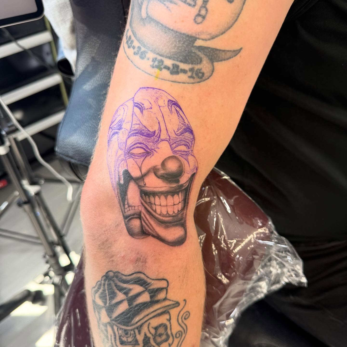 Clown face black and grey tattoo on the forearm by ♍️𝒾𝒸𝒽𝑒𝓁𝓁𝑒⁺‧₊˚ ཐི⋆♱⋆ཋྀ ˚₊‧⁺, Charlotte, North Carolina
