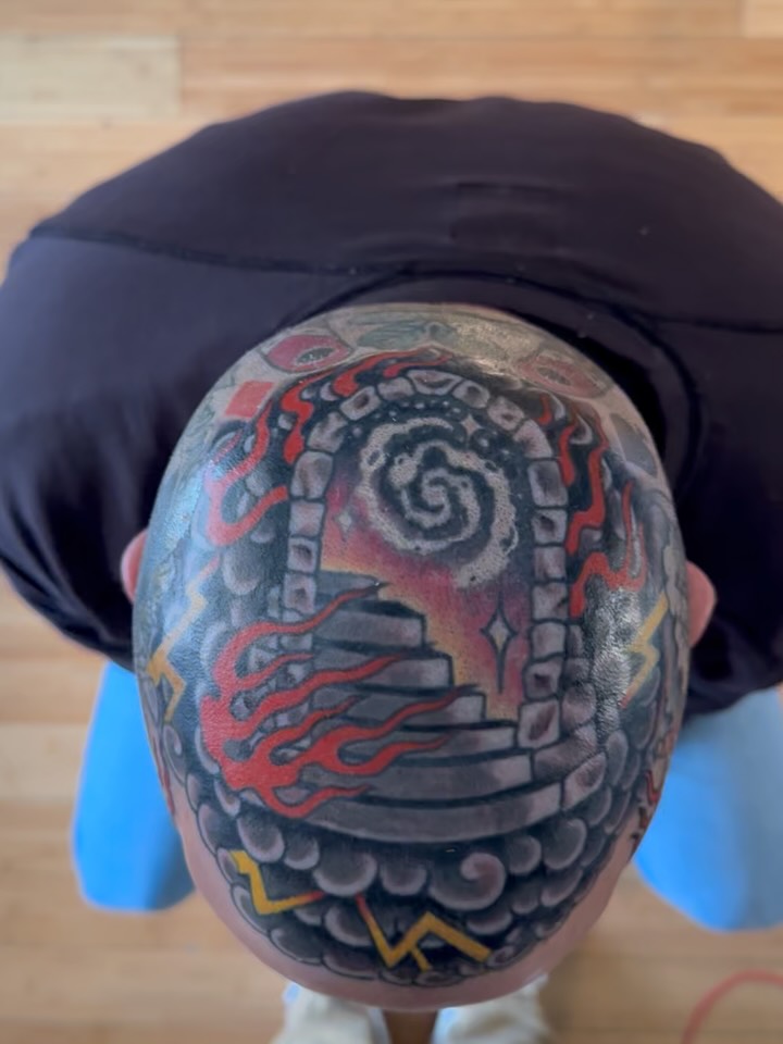 Fire and spiral staircase neo-traditional tattoo on the head by Tony Beuke