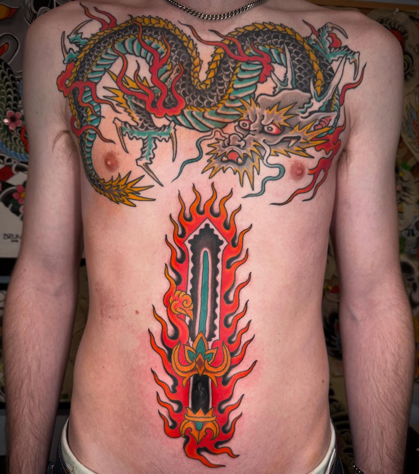 Dragon and sword japanese irezumi tattoo on the chest by Noah Moretz