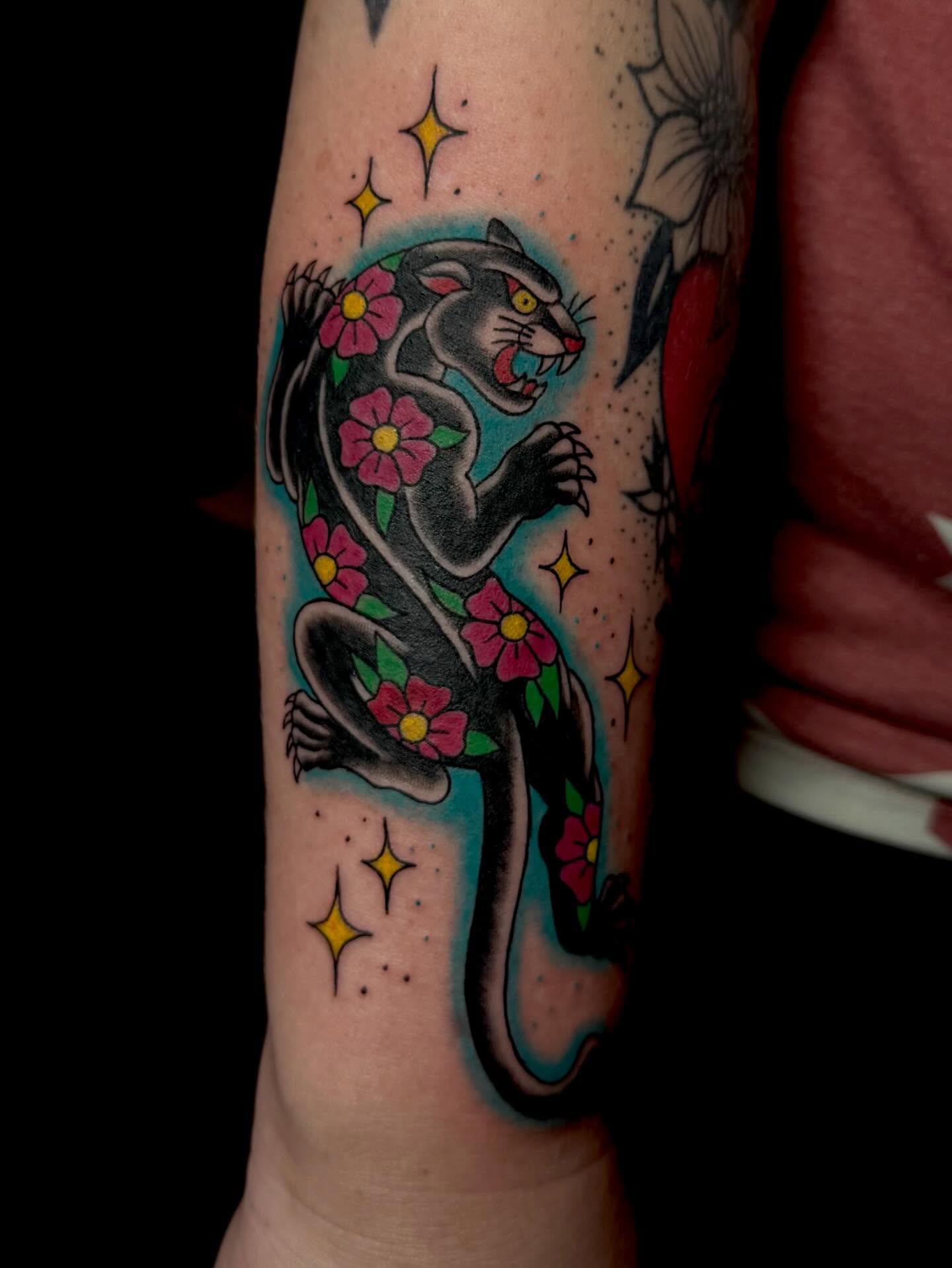 Panther with flowers American traditional tattoo on the forearm by Alaska ⚜️