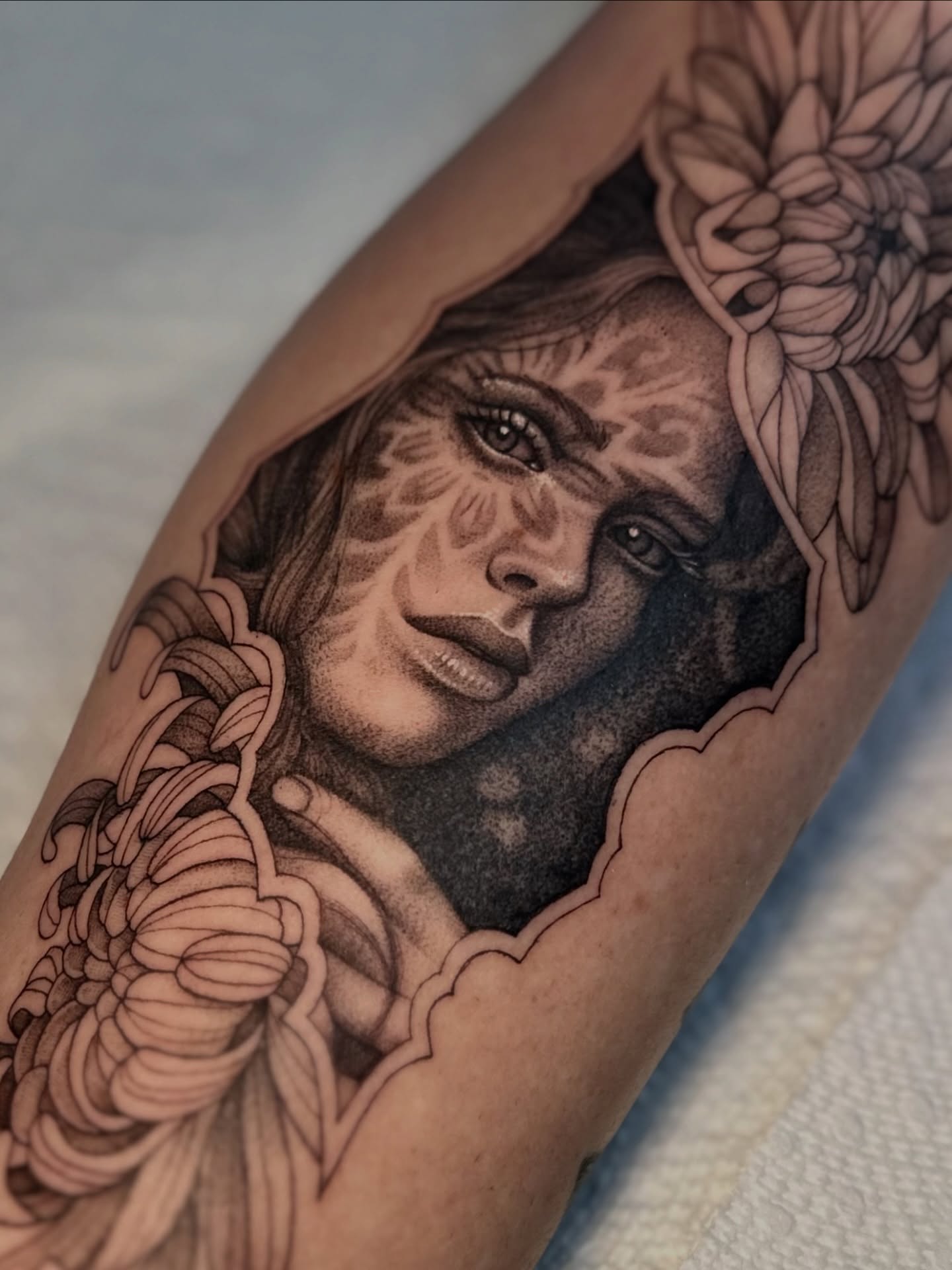 Woman's face realism tattoo on the forearm by Ghost