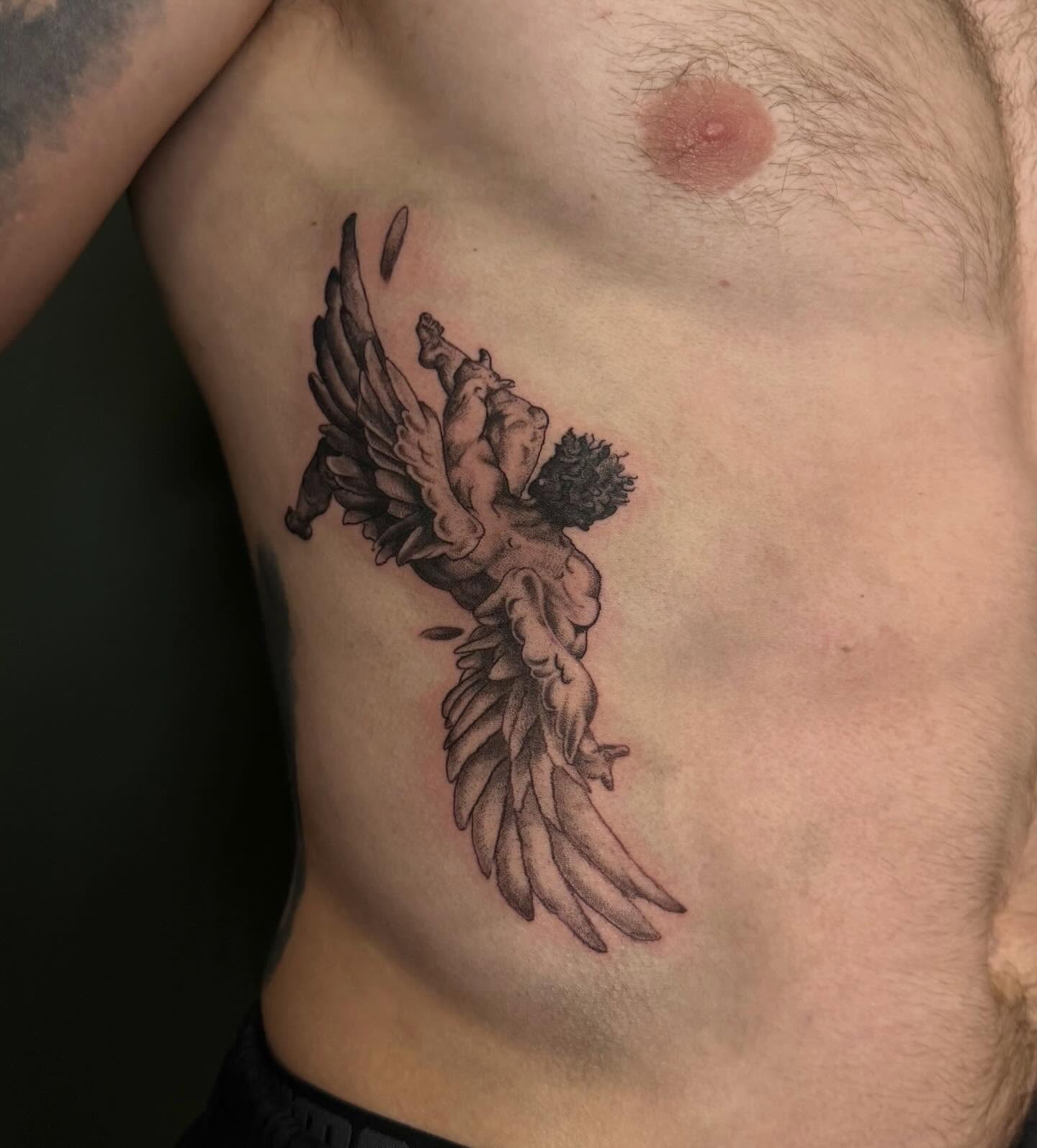 Angel black and grey tattoo on the chest by Bailee