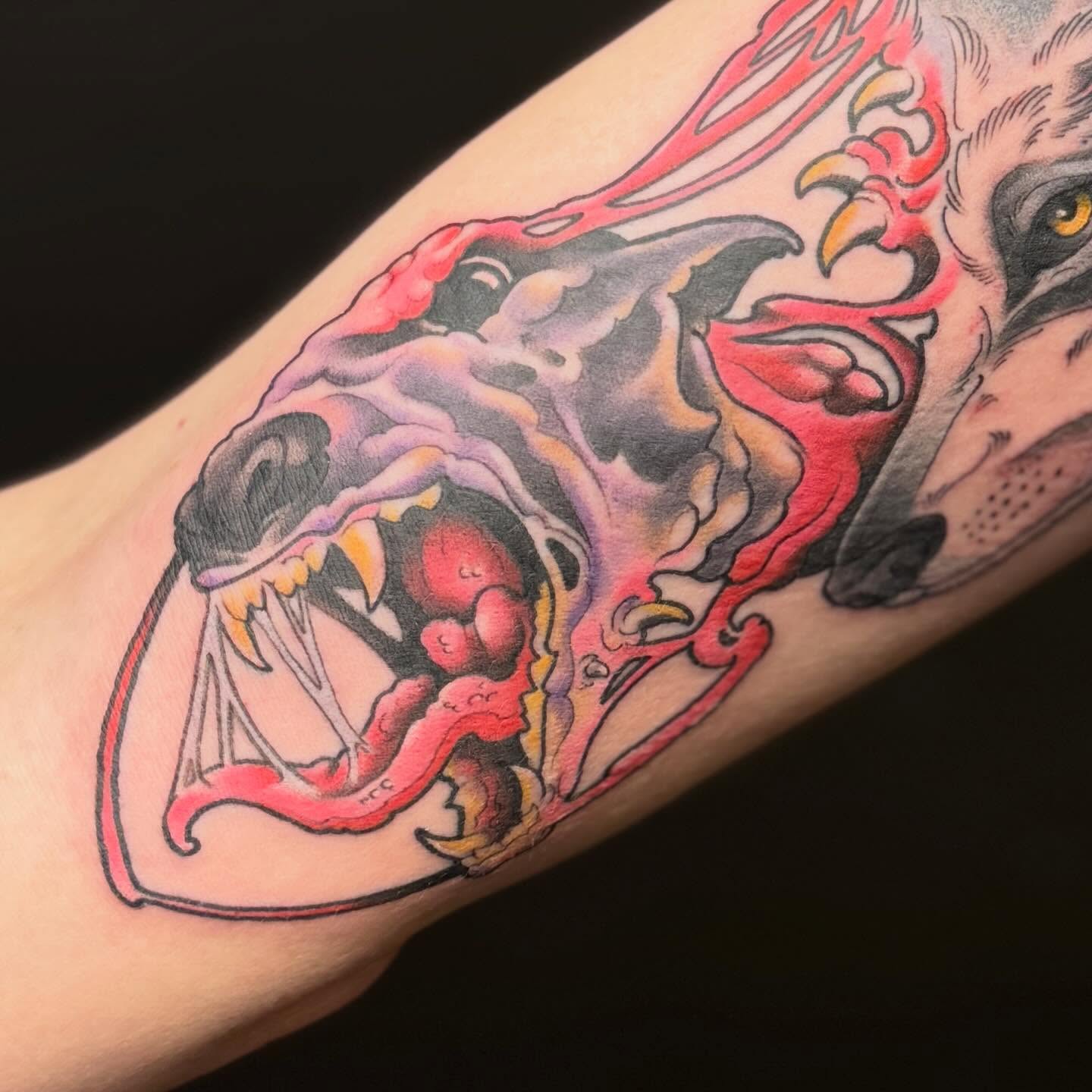Wolf American traditional tattoo on the forearm by Chase Martines