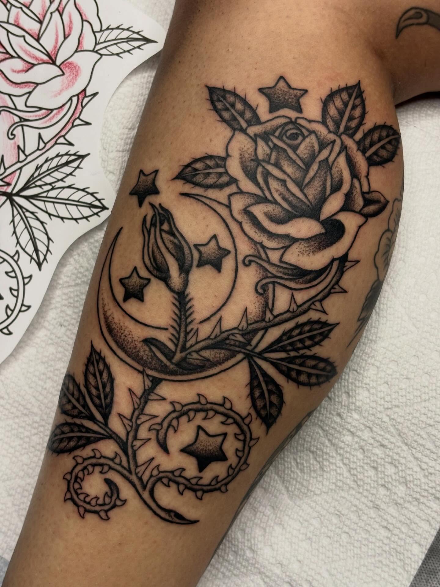 Rose and crescent moon black and grey tattoo on the forearm by Sydney Pflaumer