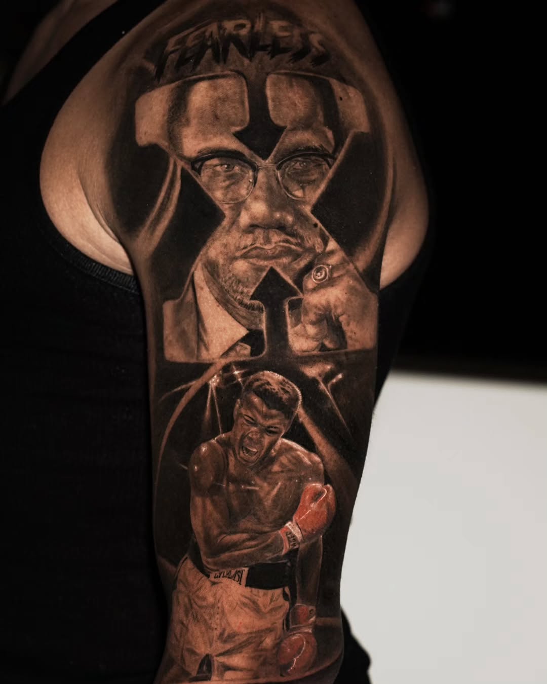 Malcolm X and Muhammad Ali portraits realism tattoo on the forearm by Baxtertattoo