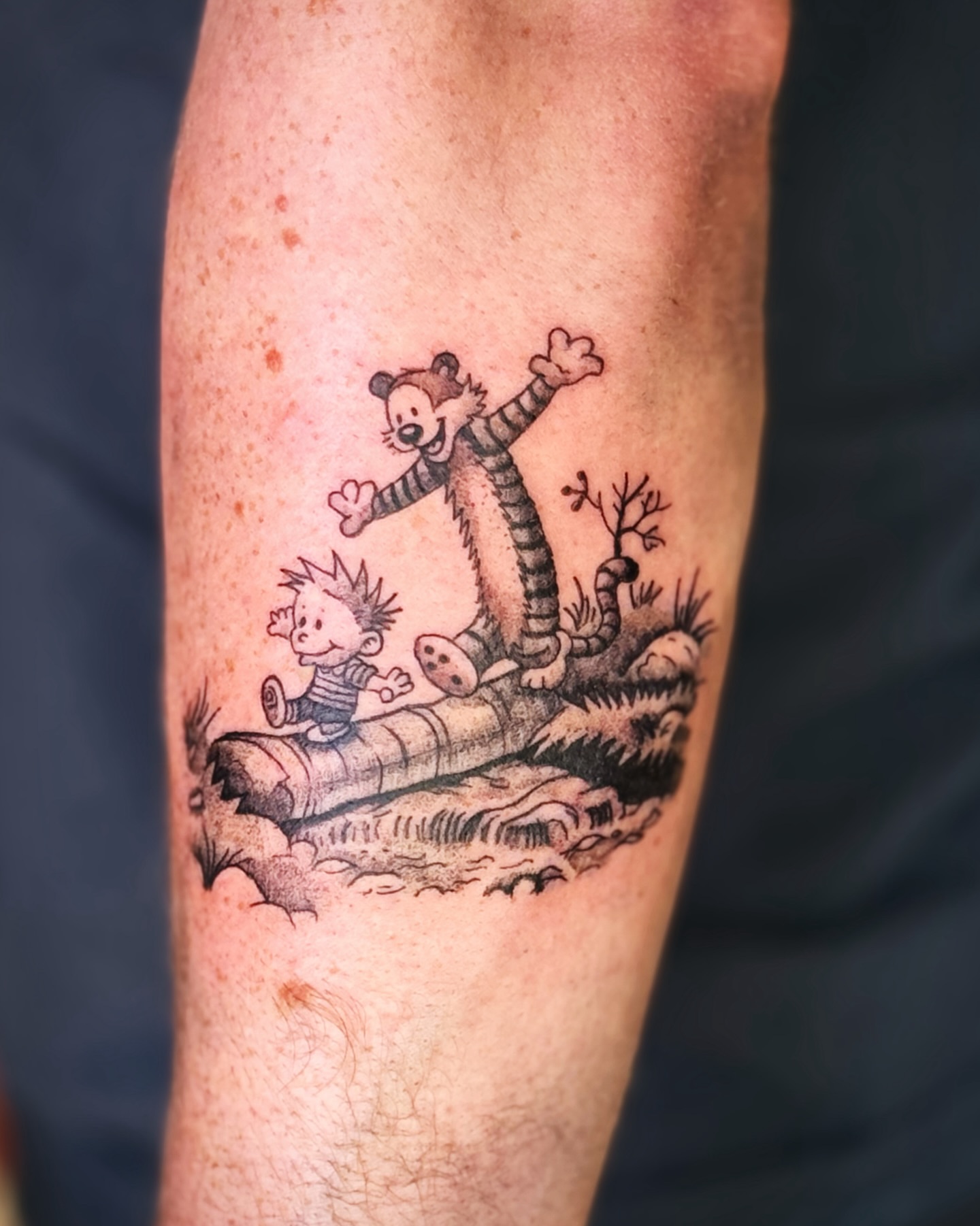 Calvin and hobbes dotwork tattoo on the forearm by Kate