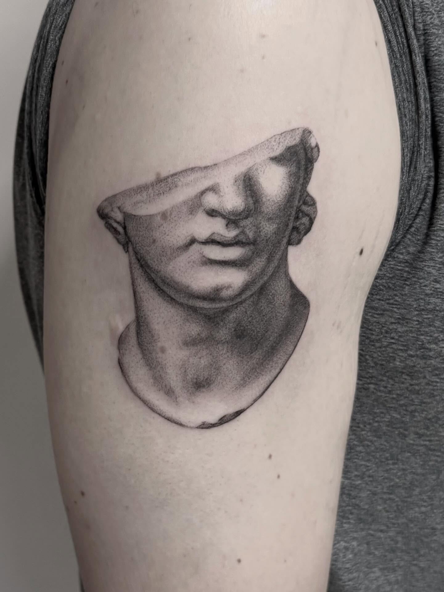 Statue head dotwork tattoo on the forearm by Peter Harren