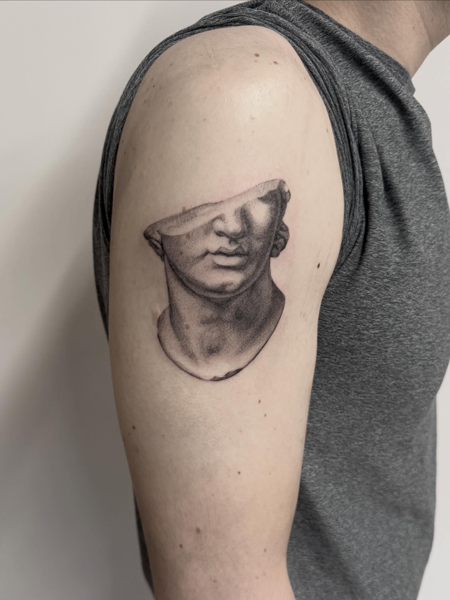 Abstract bust realism tattoo on the shoulder by Peter Harren